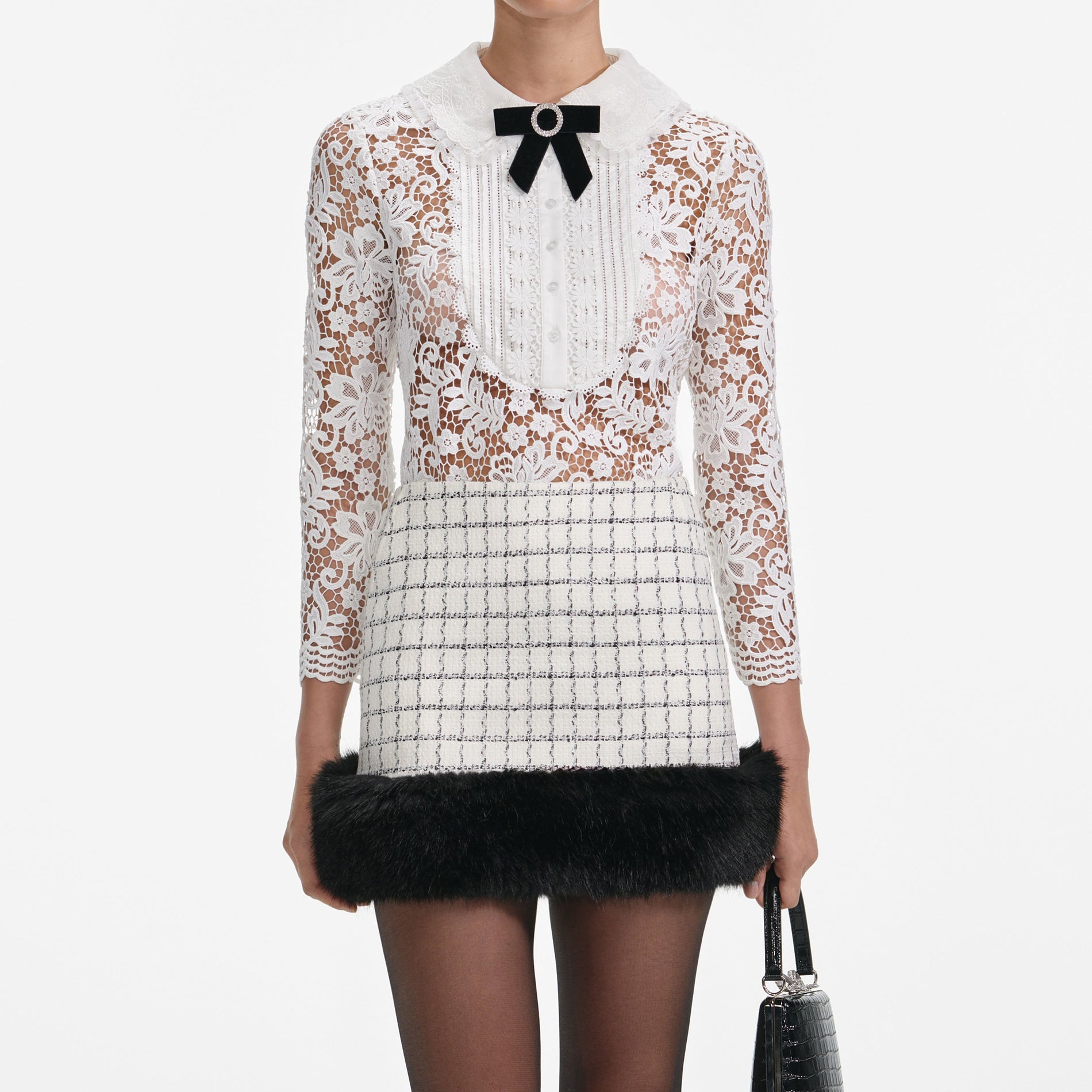 A close up of a woman wearing the White Lace Blouse