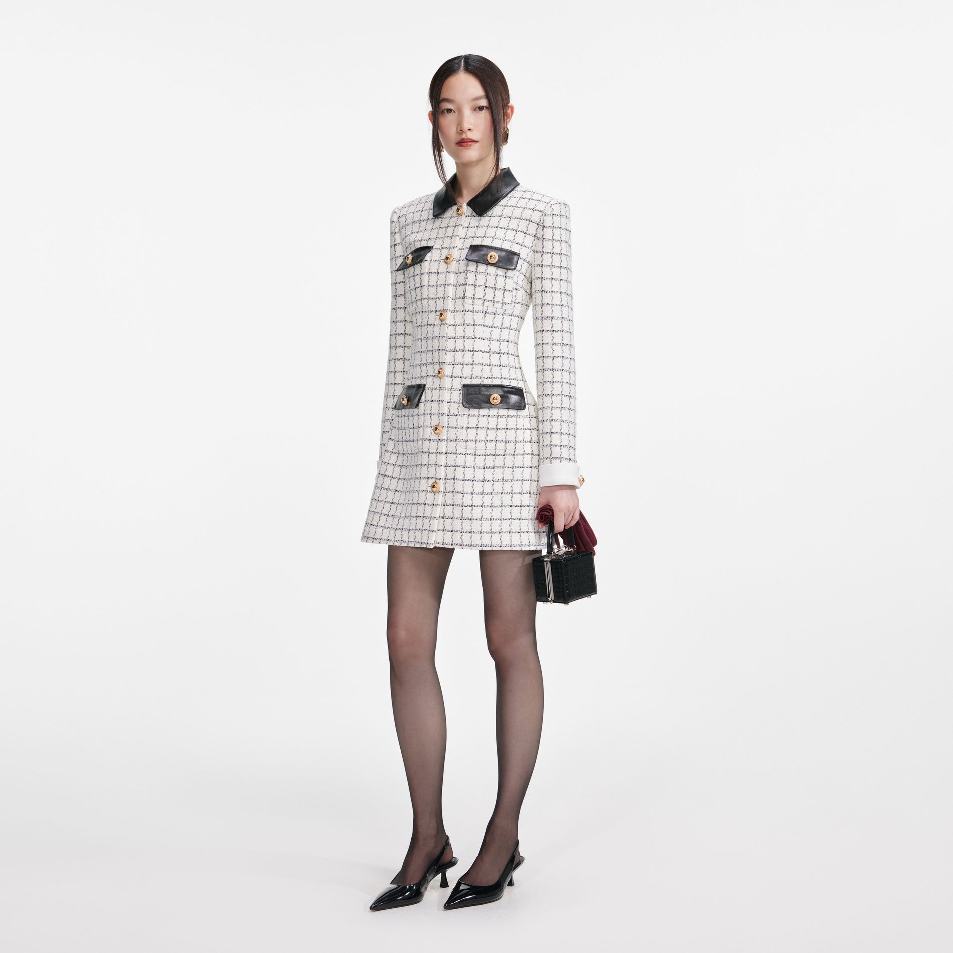 Side view of a woman wearing the Check Boucle Long Sleeve Mini Dress