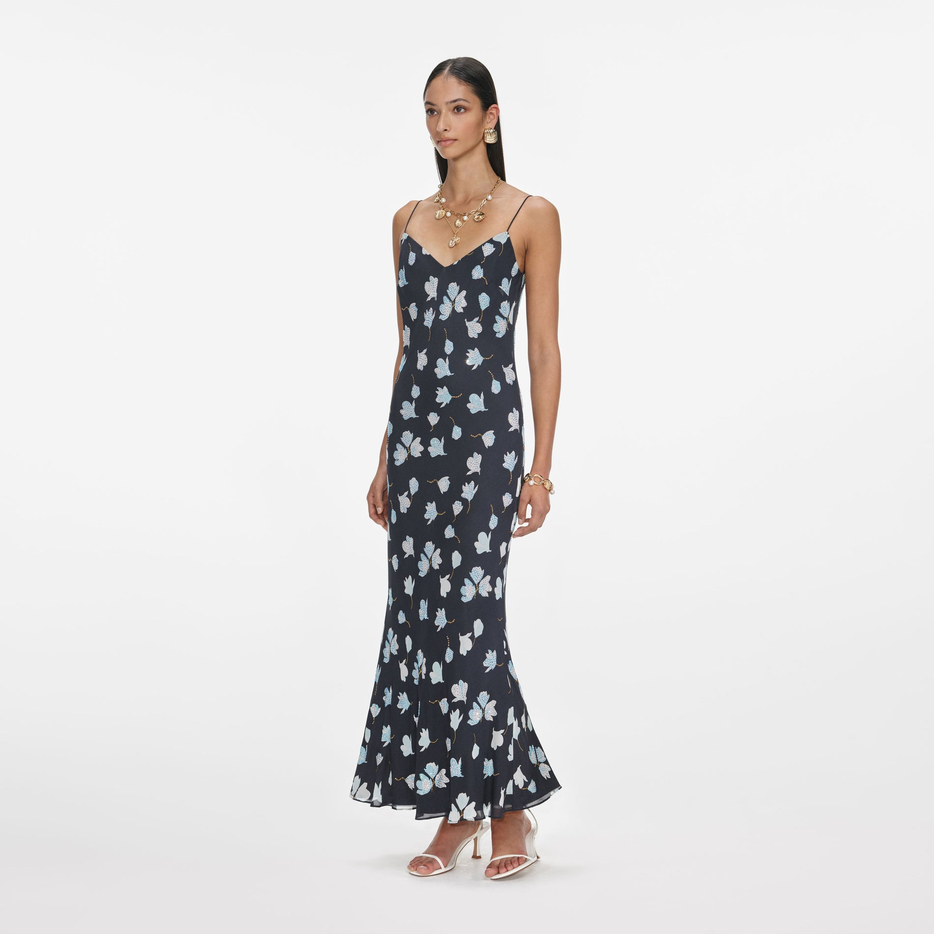 Side view of a woman wearing the Navy Floral Rhinestone Midi Dress