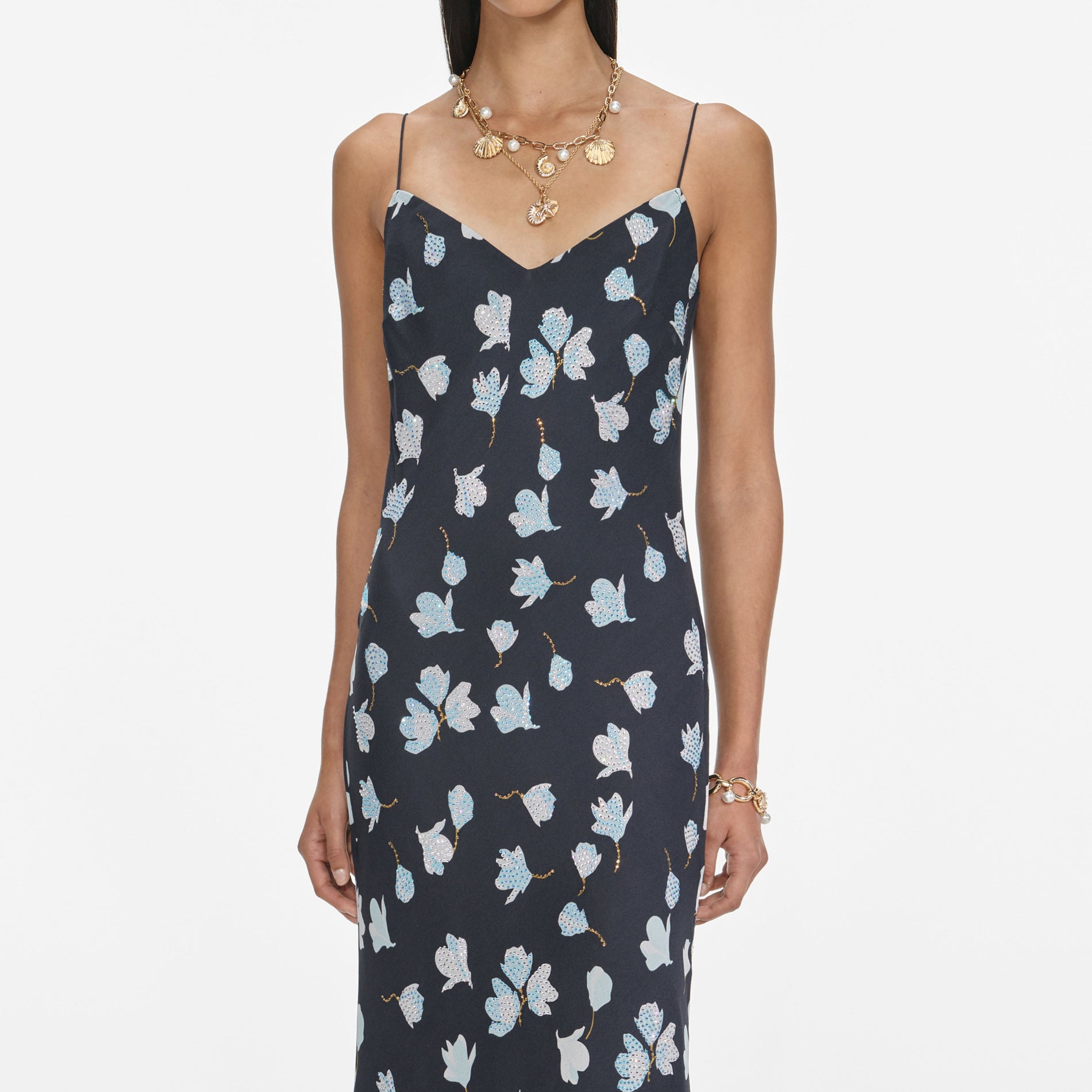 A close up of a woman wearing the Navy Floral Rhinestone Midi Dress