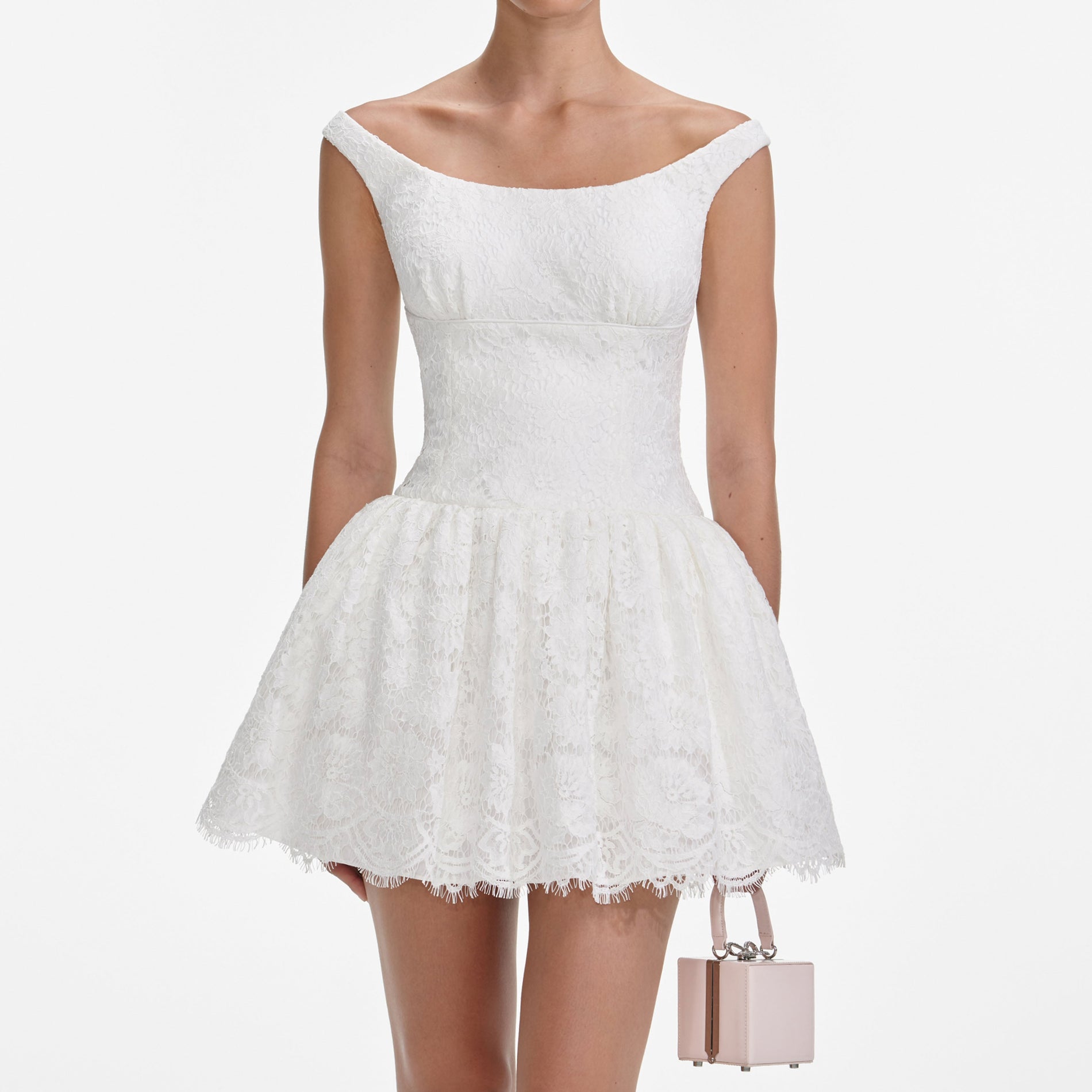 A close up of a woman wearing the White Floral Lace Mini Dress