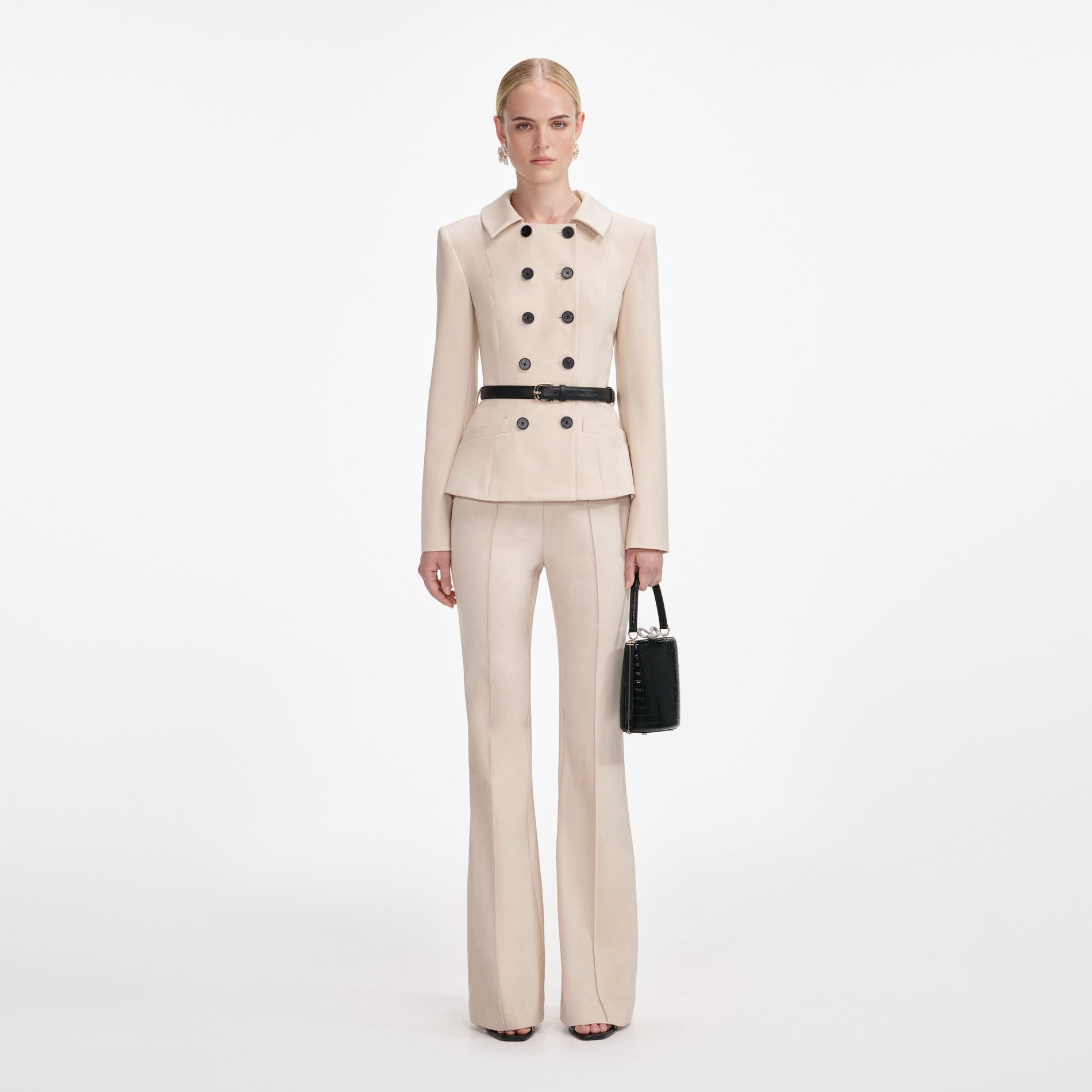 Front view of a woman wearing the Beige Twill Jumpsuit