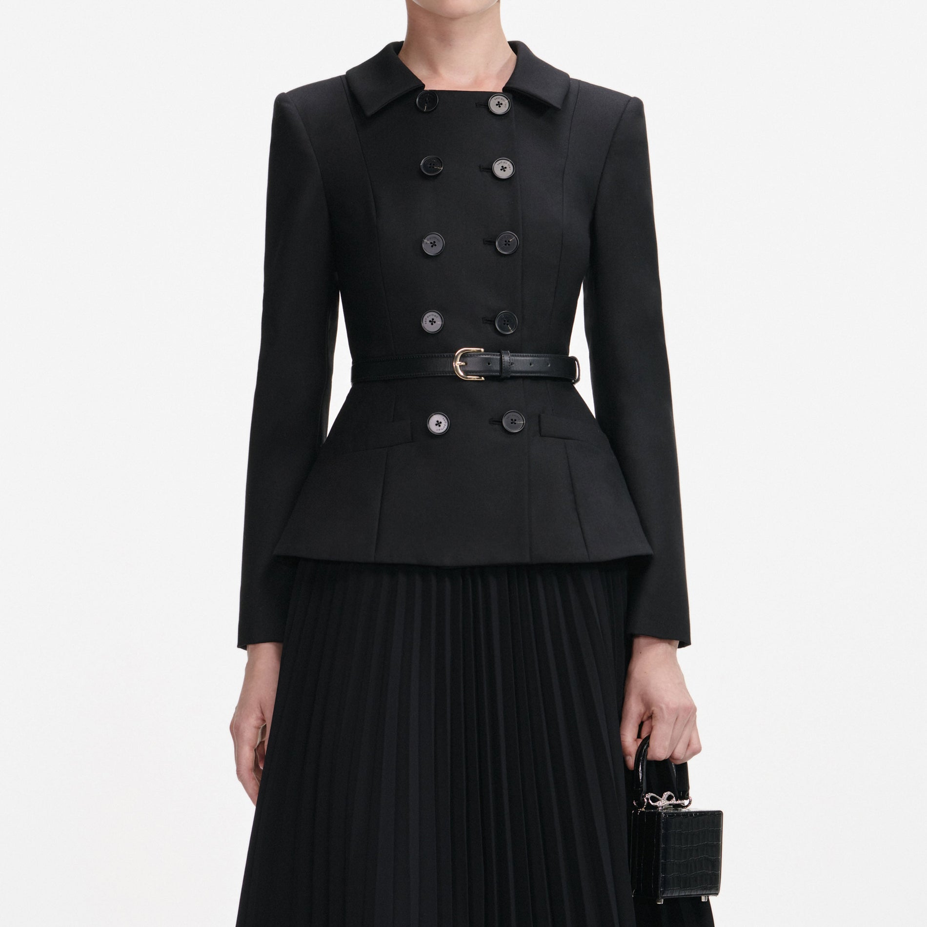 A close up of a woman wearing the Black Wool Crepe Midi Dress