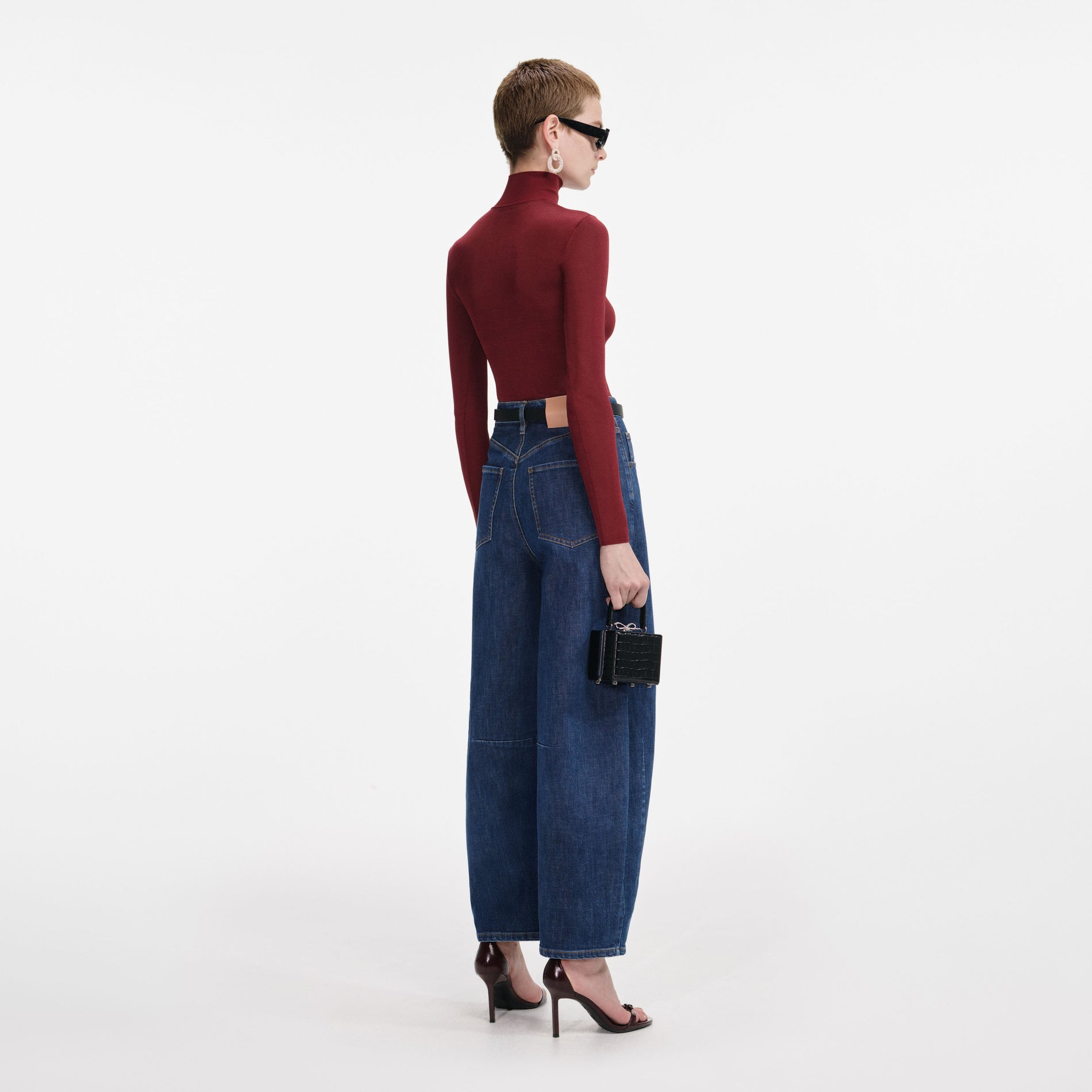 Back view of a woman wearing the Burgundy Viscose Knit Top