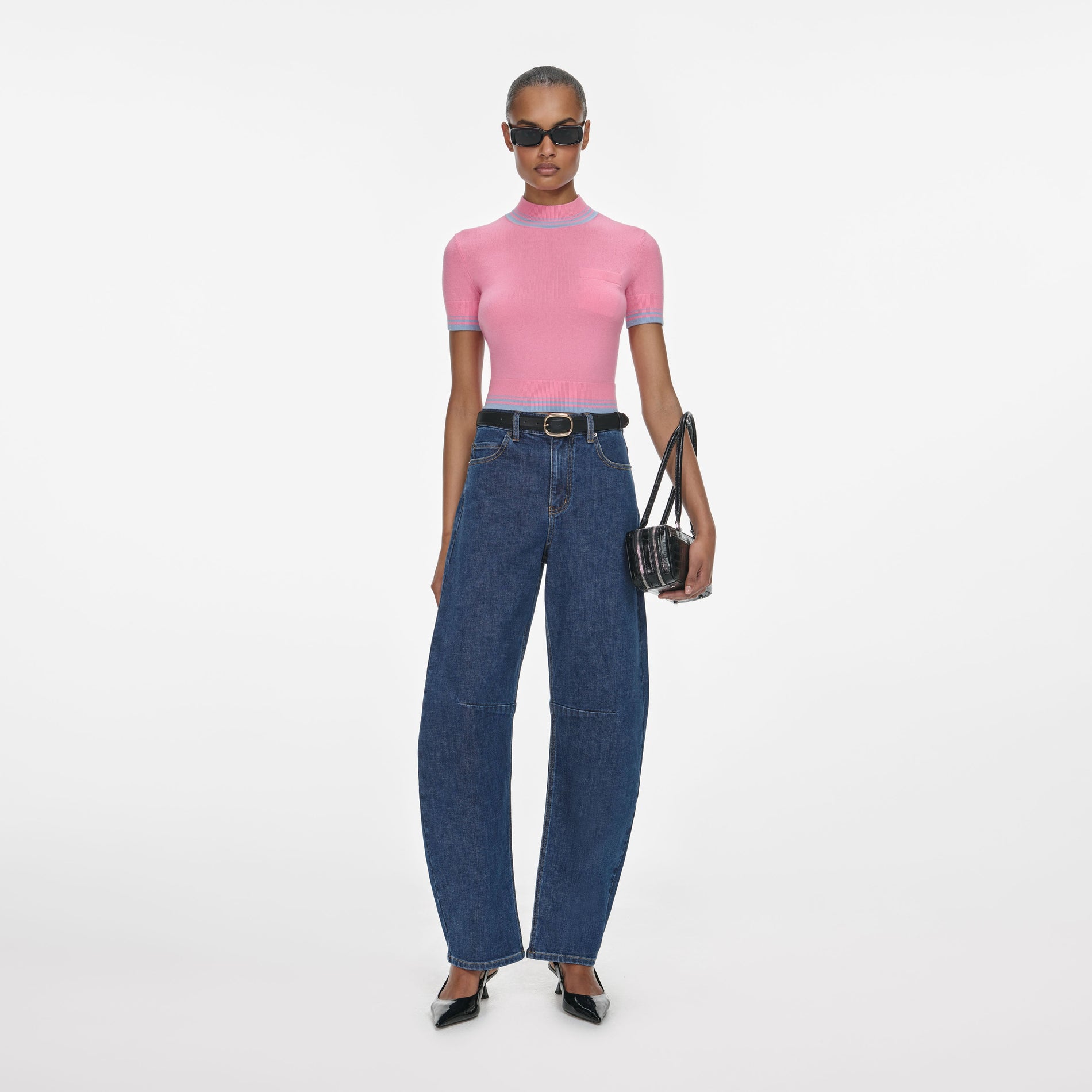 Front view of a woman wearing the Pink Contrast Stripe Knit Top