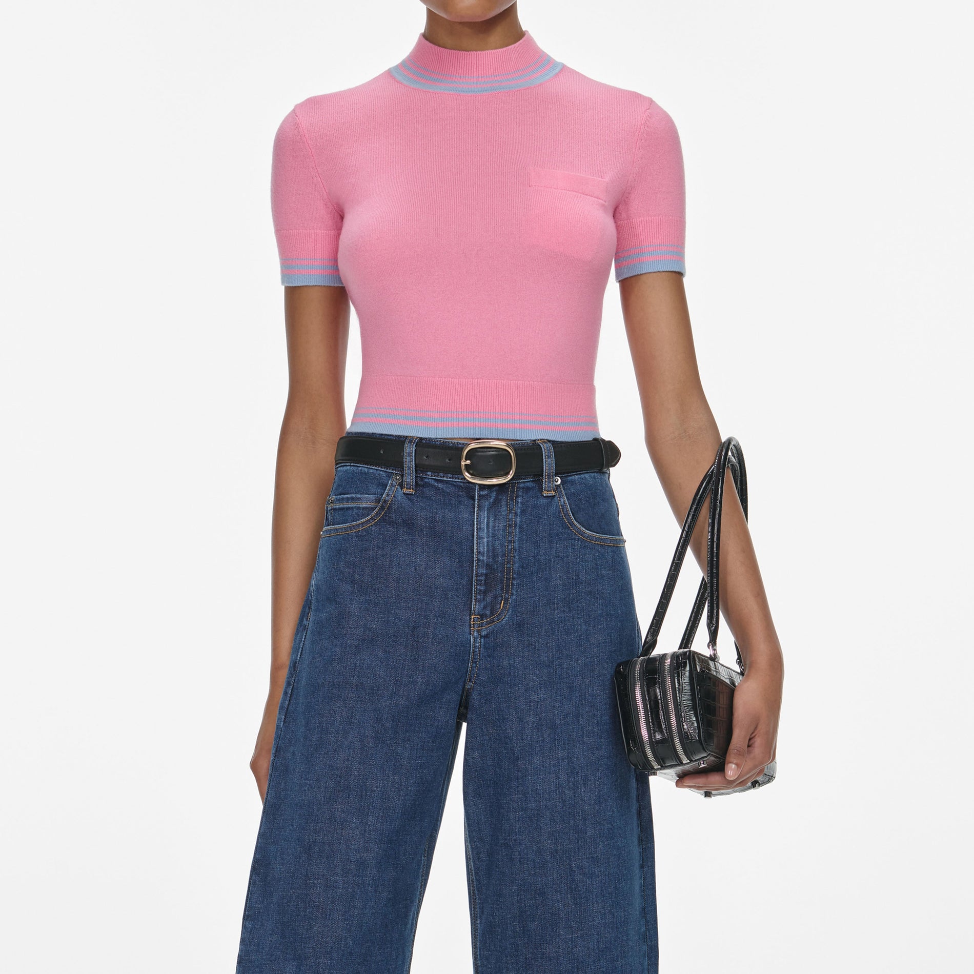 A close up of a woman wearing the Pink Contrast Stripe Knit Top