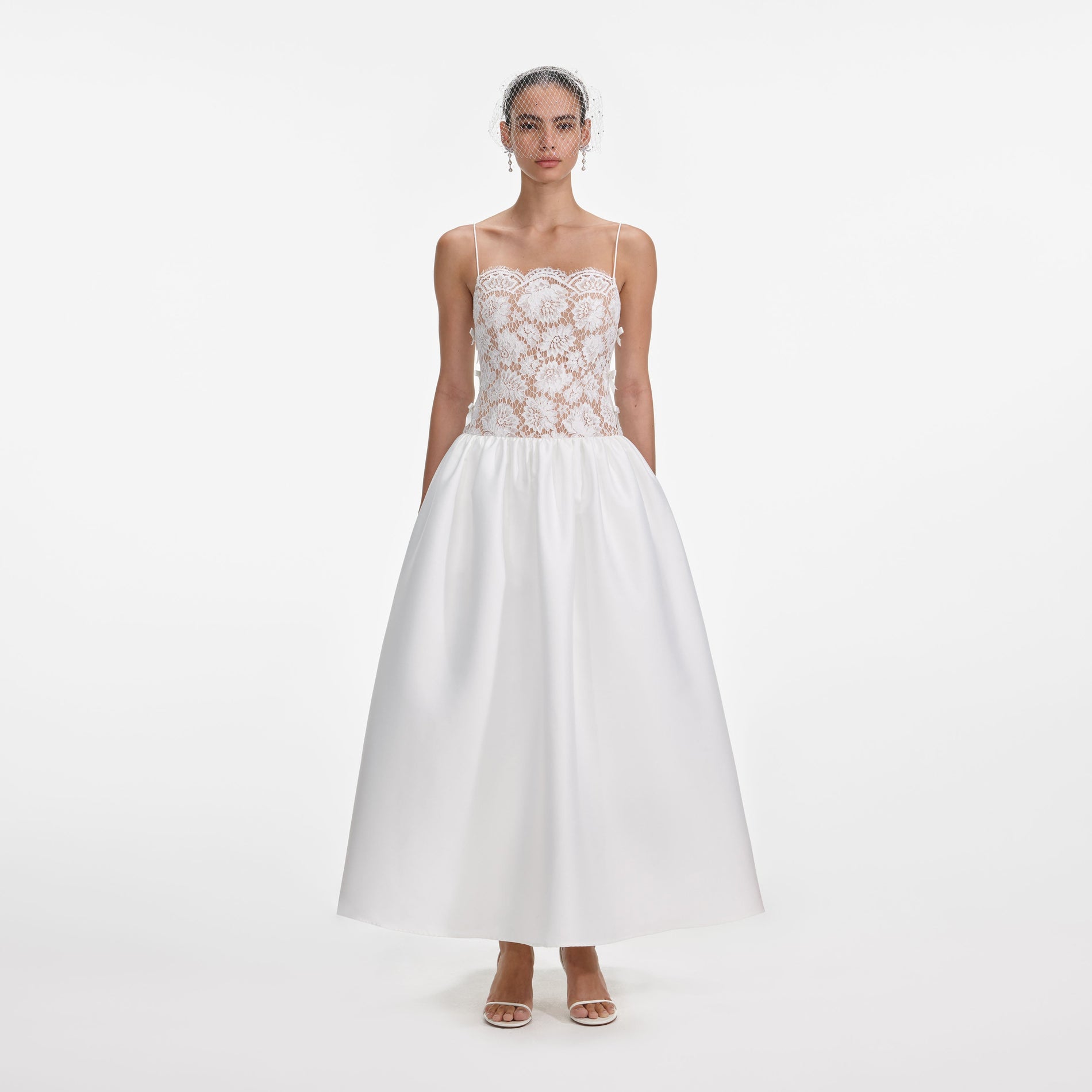 Front view of a woman wearing the White Lace Taffeta Maxi Dress