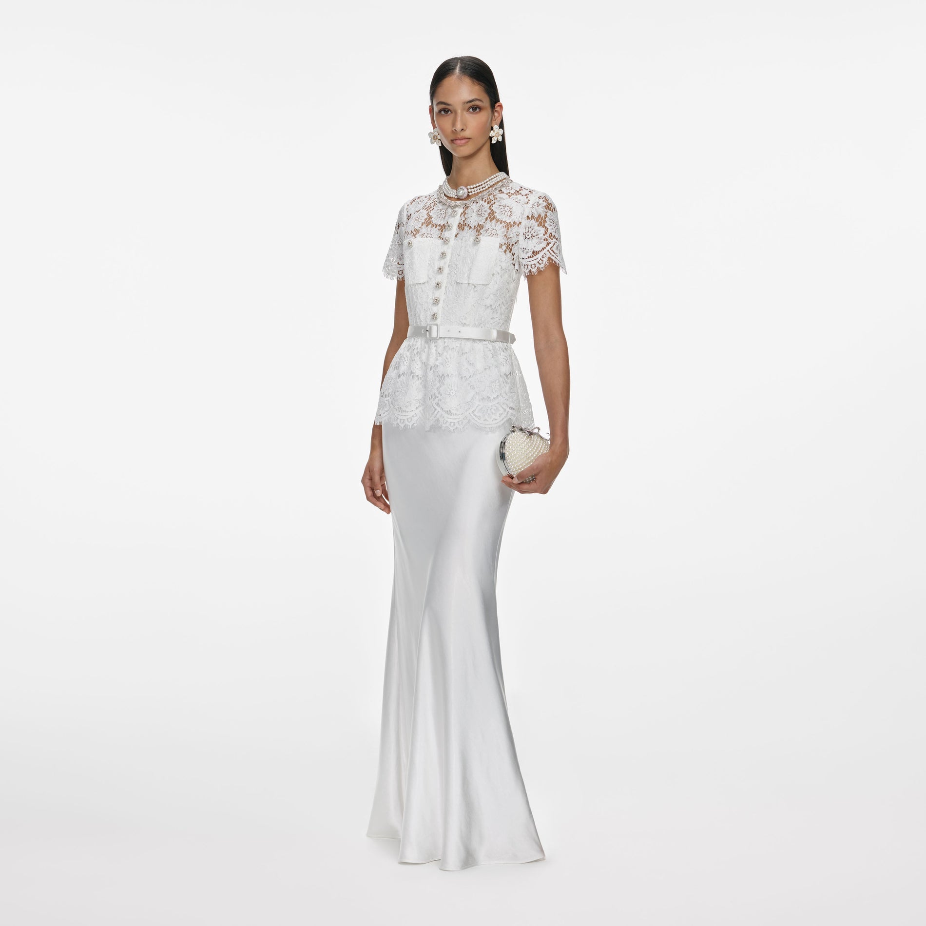 Side view of a woman wearing the White Lace Satin Maxi Dress