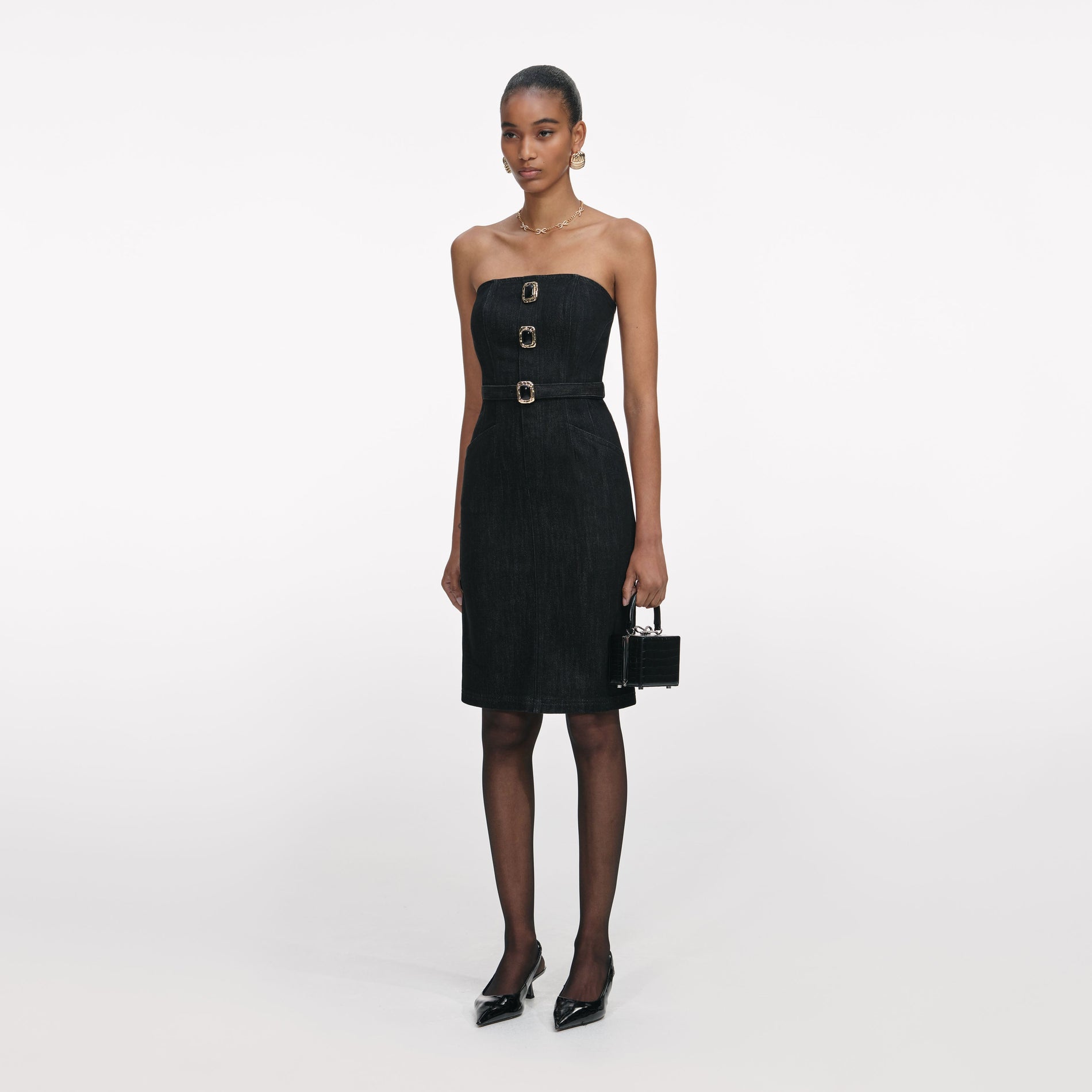 Side view of a woman wearing the Black Denim Bandeau Midi Dress