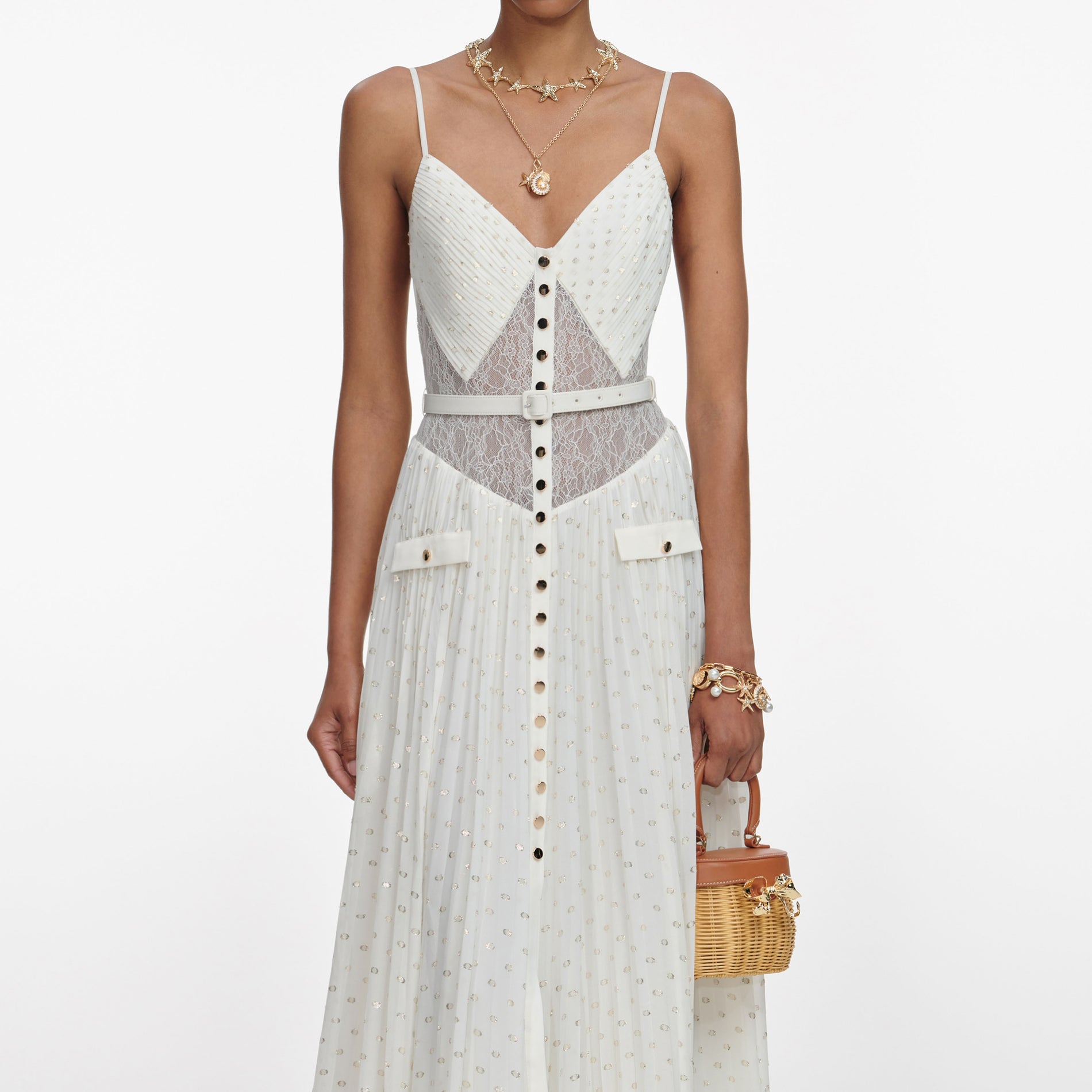 A close up of a woman wearing the Cream And Gold Chiffon Maxi Dress