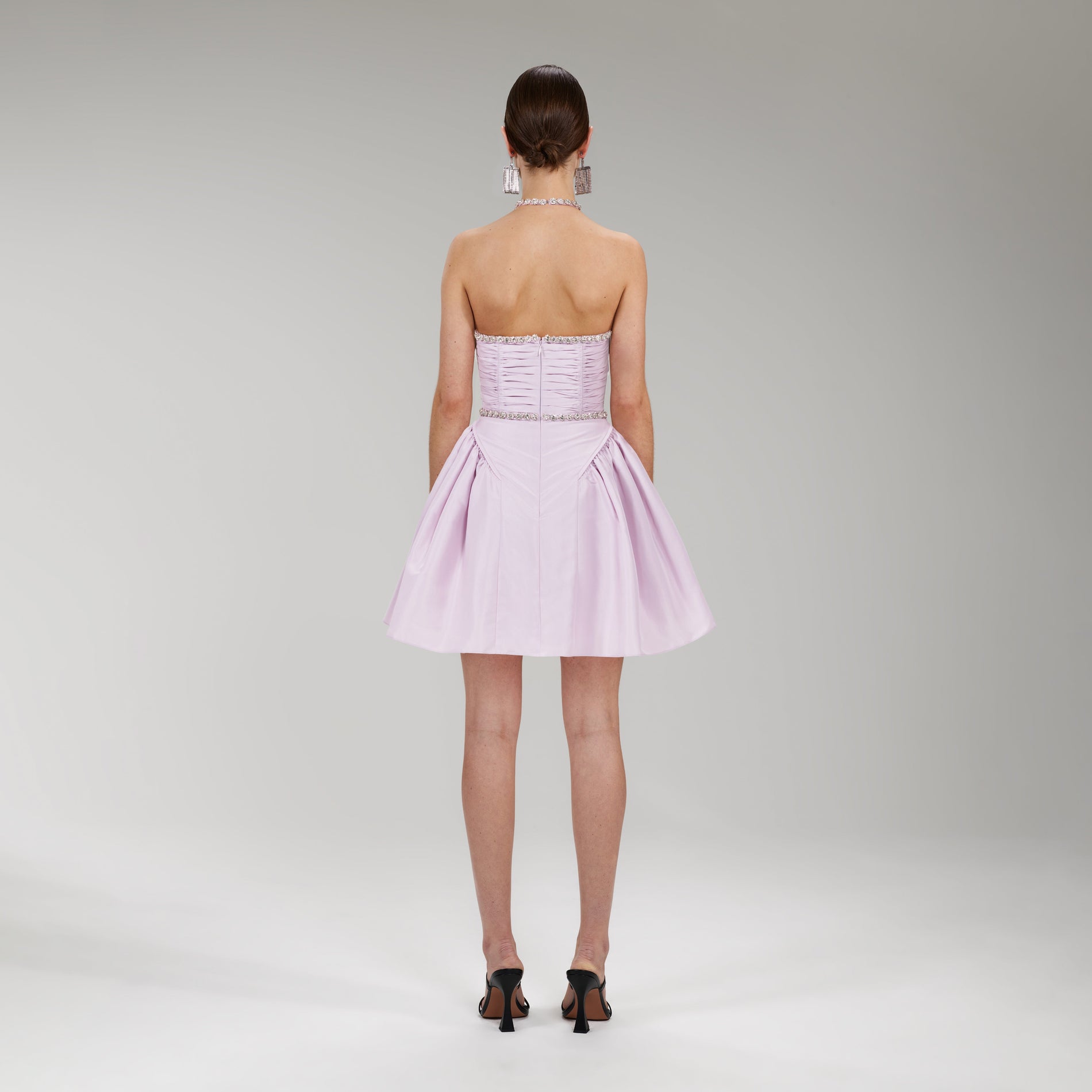 A woman wearing the Lilac Taffeta Diamanté Trim Mini Dress