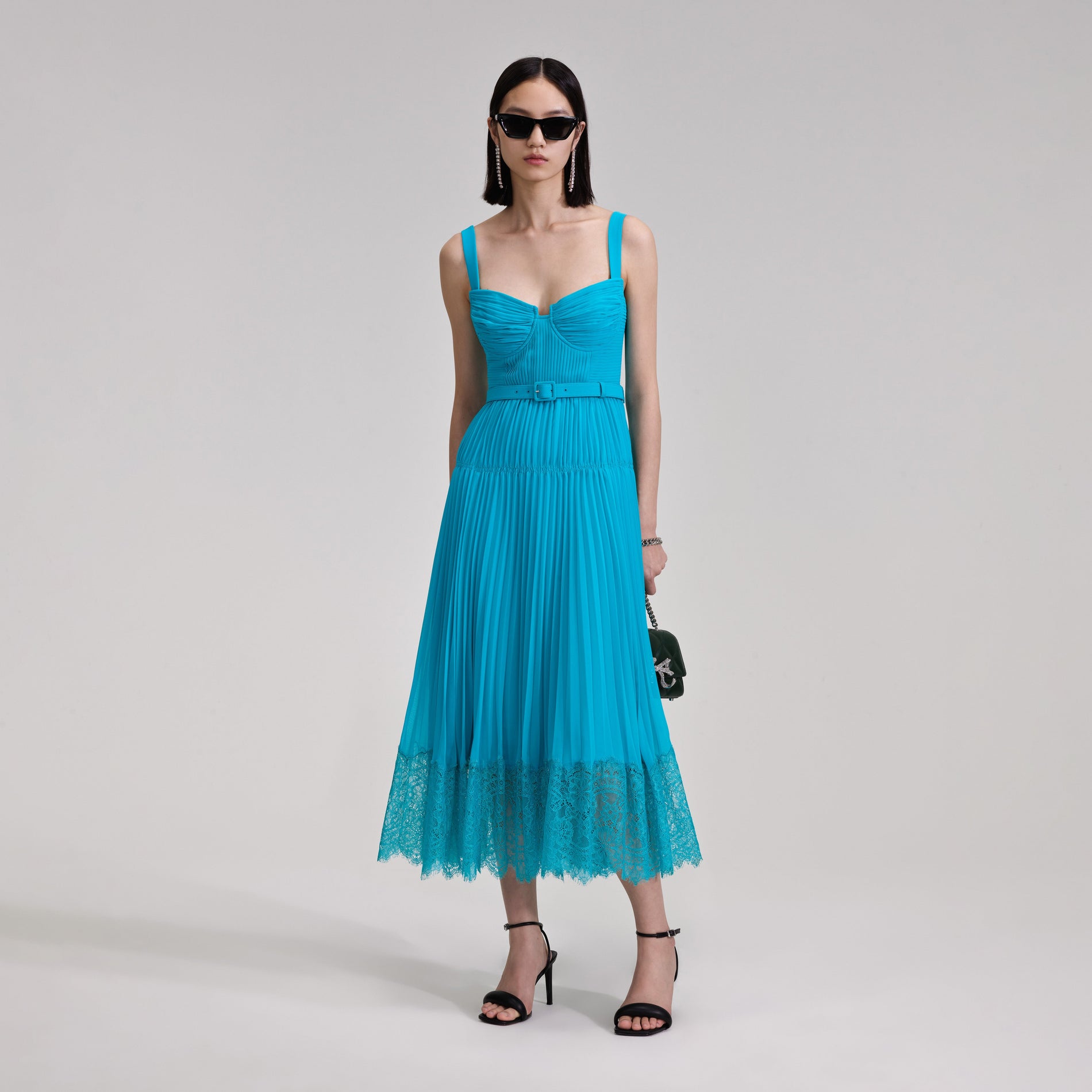 A woman wearing the Blue Chiffon Lace Midi Dress