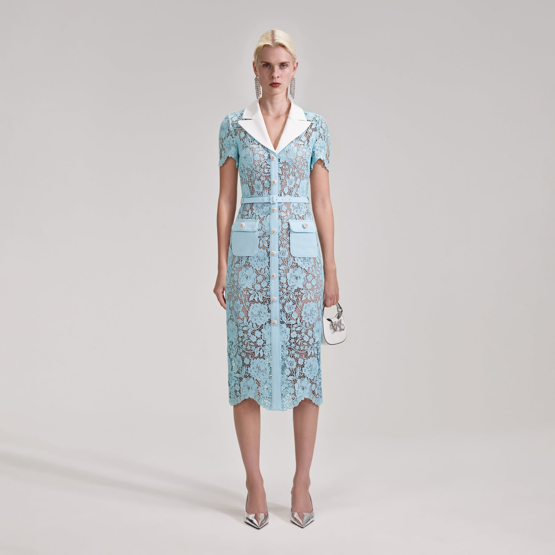 A woman wearing the Blue Cord Lace Midi Dress