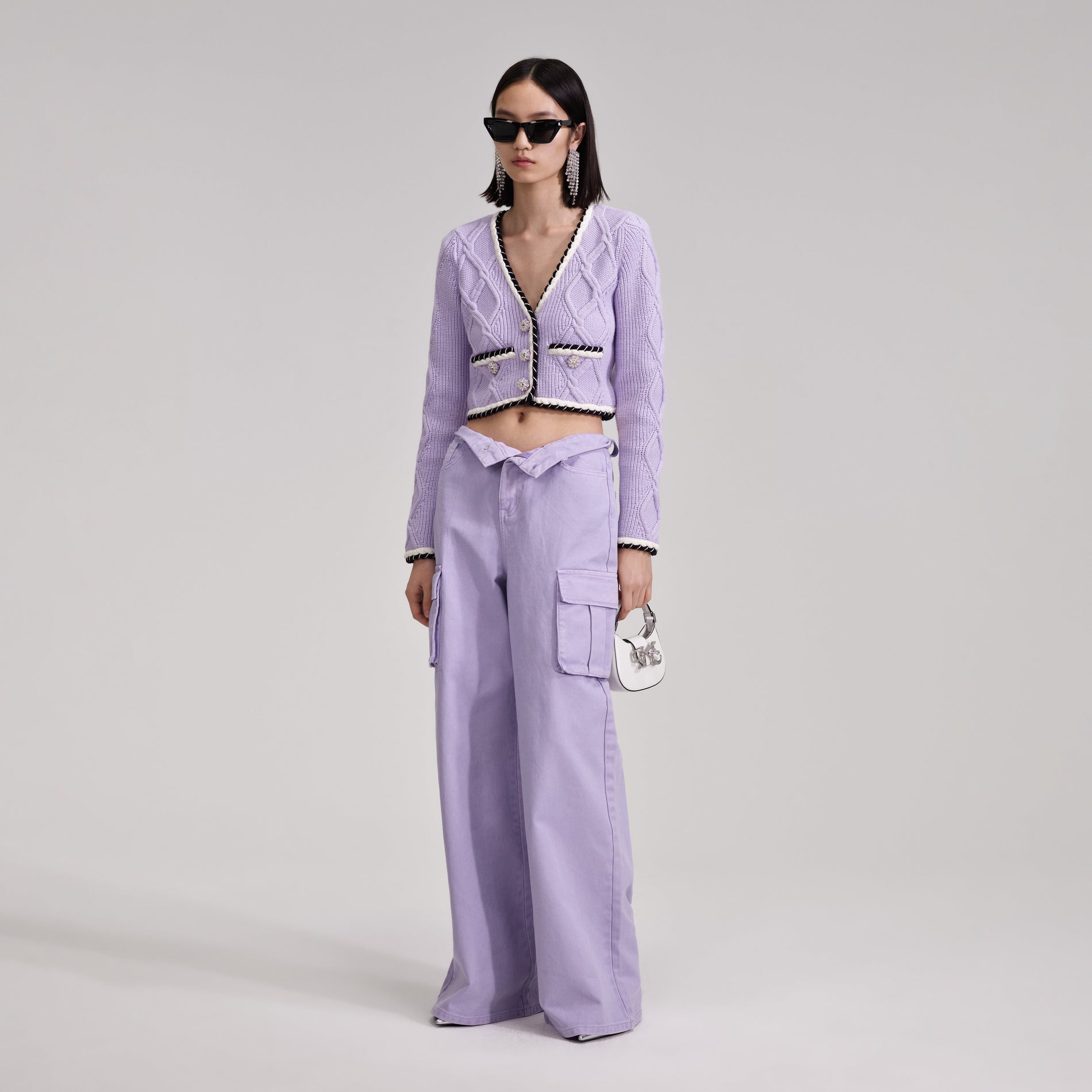 A woman wearing the Lilac Knit Cardigan