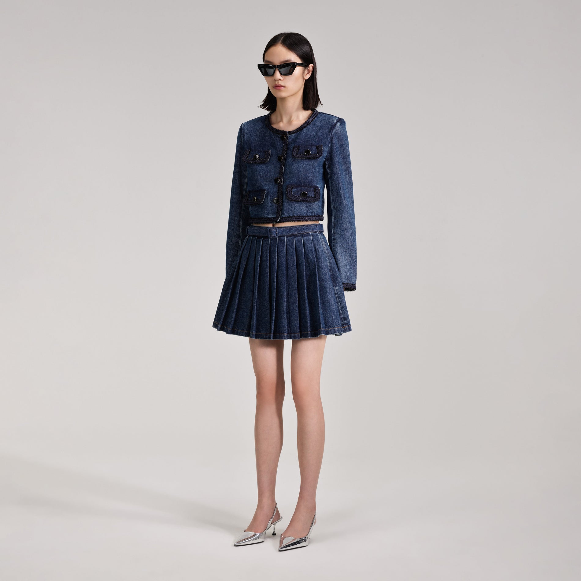 A woman wearing the Braid Detail Denim Jacket