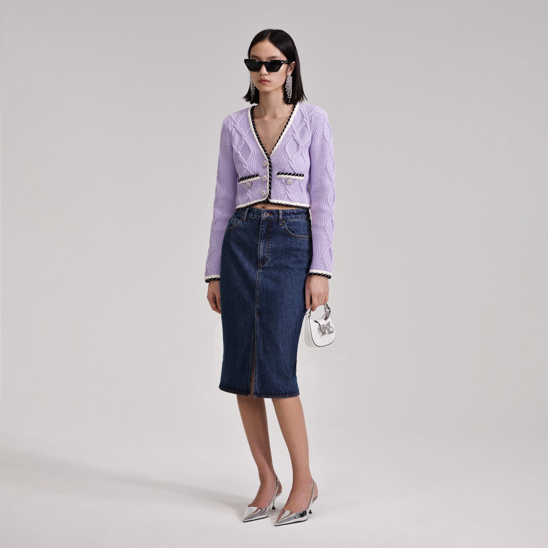 A woman wearing the Denim Midi Skirt