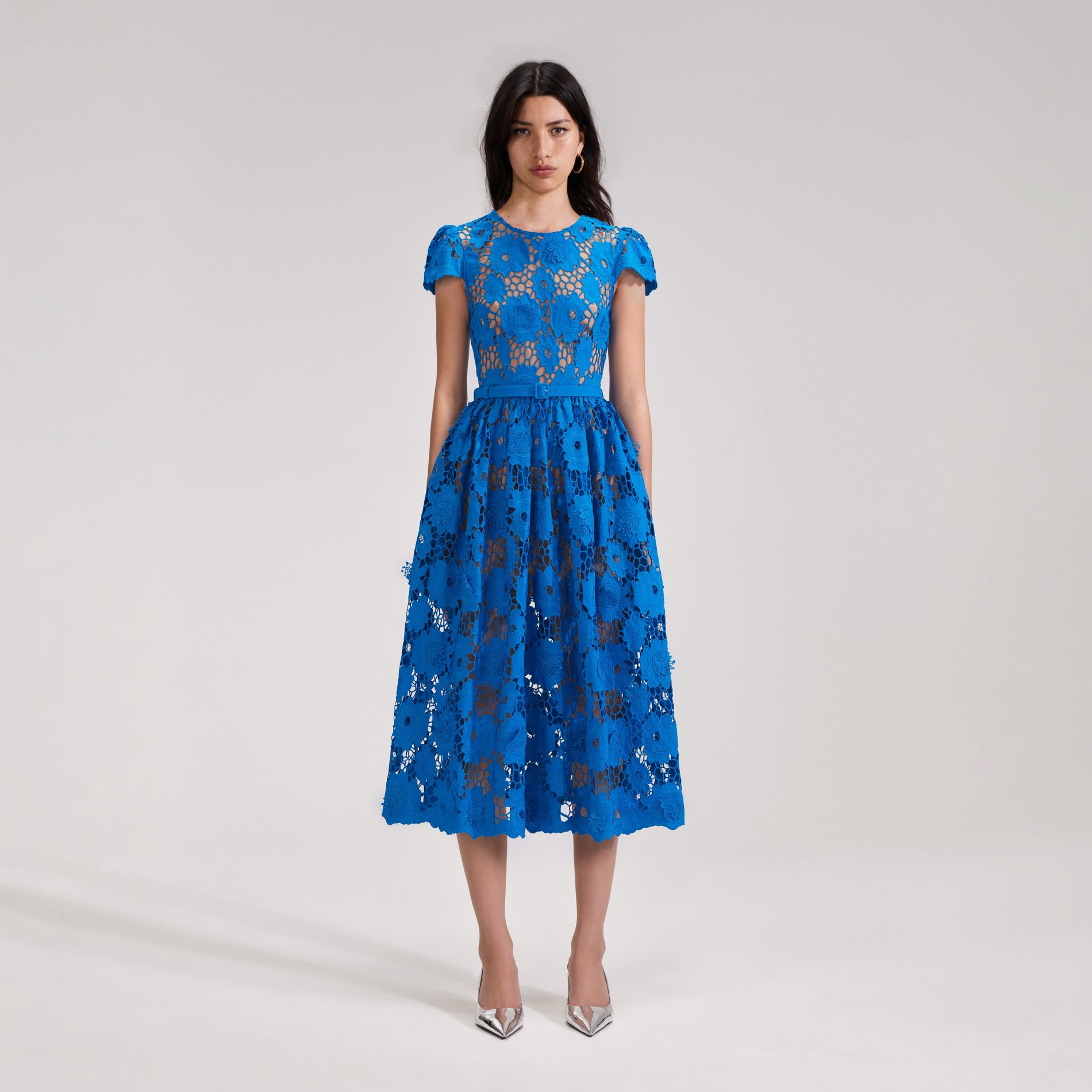 A woman wearing the Blue Poppy Midi Dress