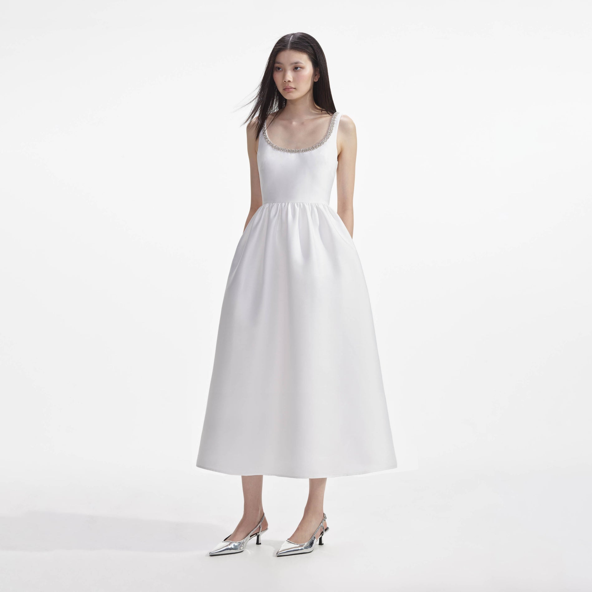 Side view of a woman wearing the White Taffeta Diamante Midi Dress