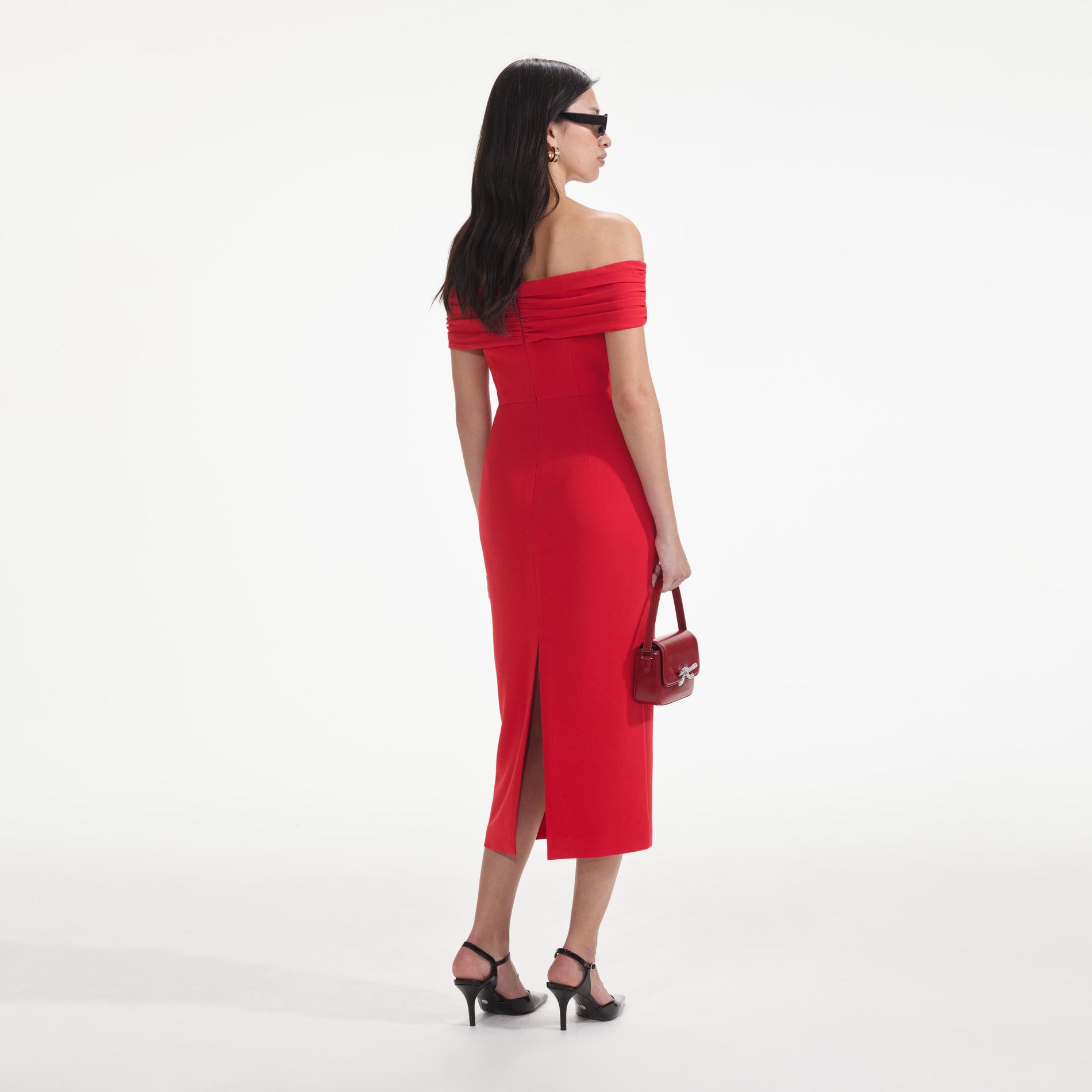 Back view of a woman wearing the Red Off Shoulder Midi Dress