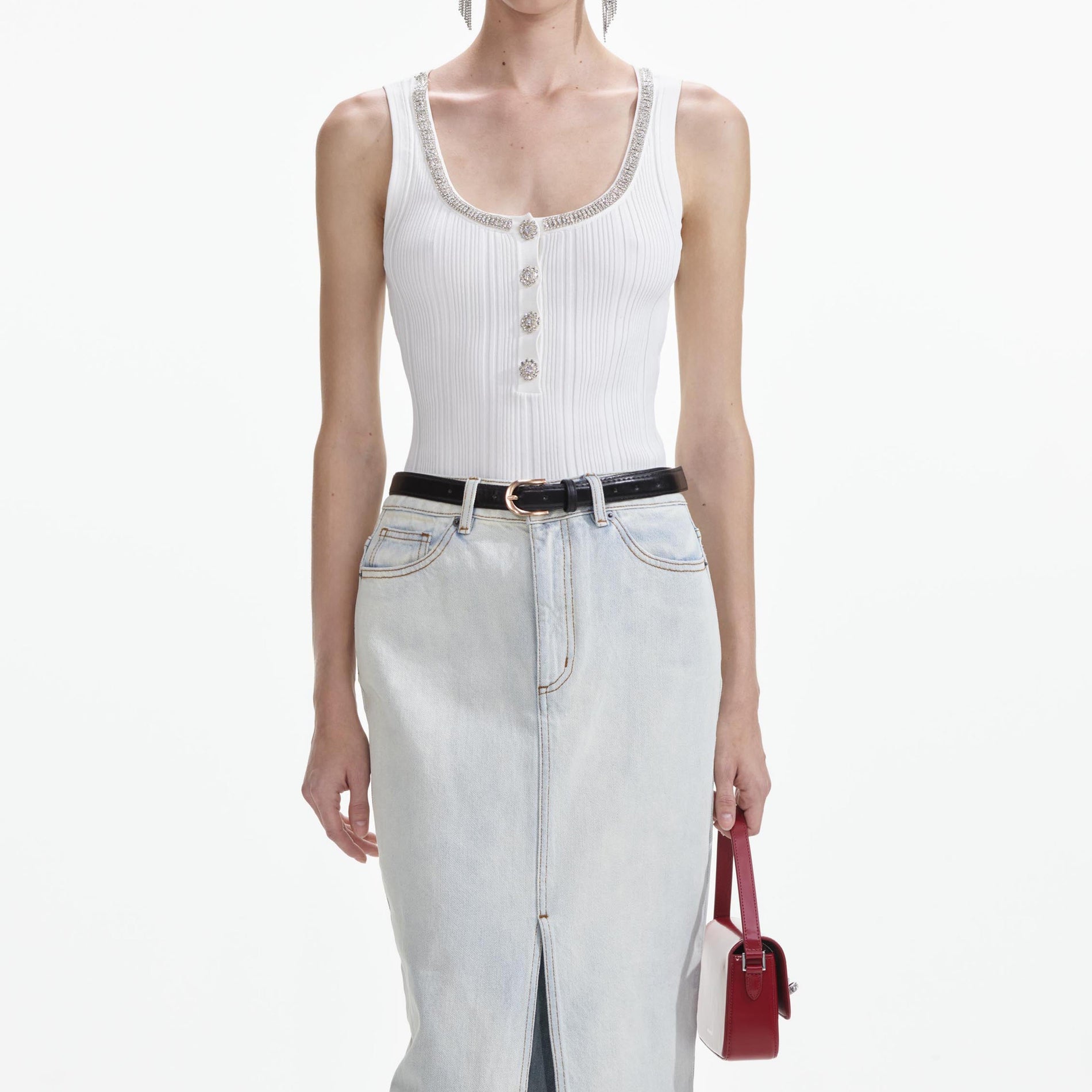 A close up of a woman wearing the Bleach Wash Denim Maxi Skirt