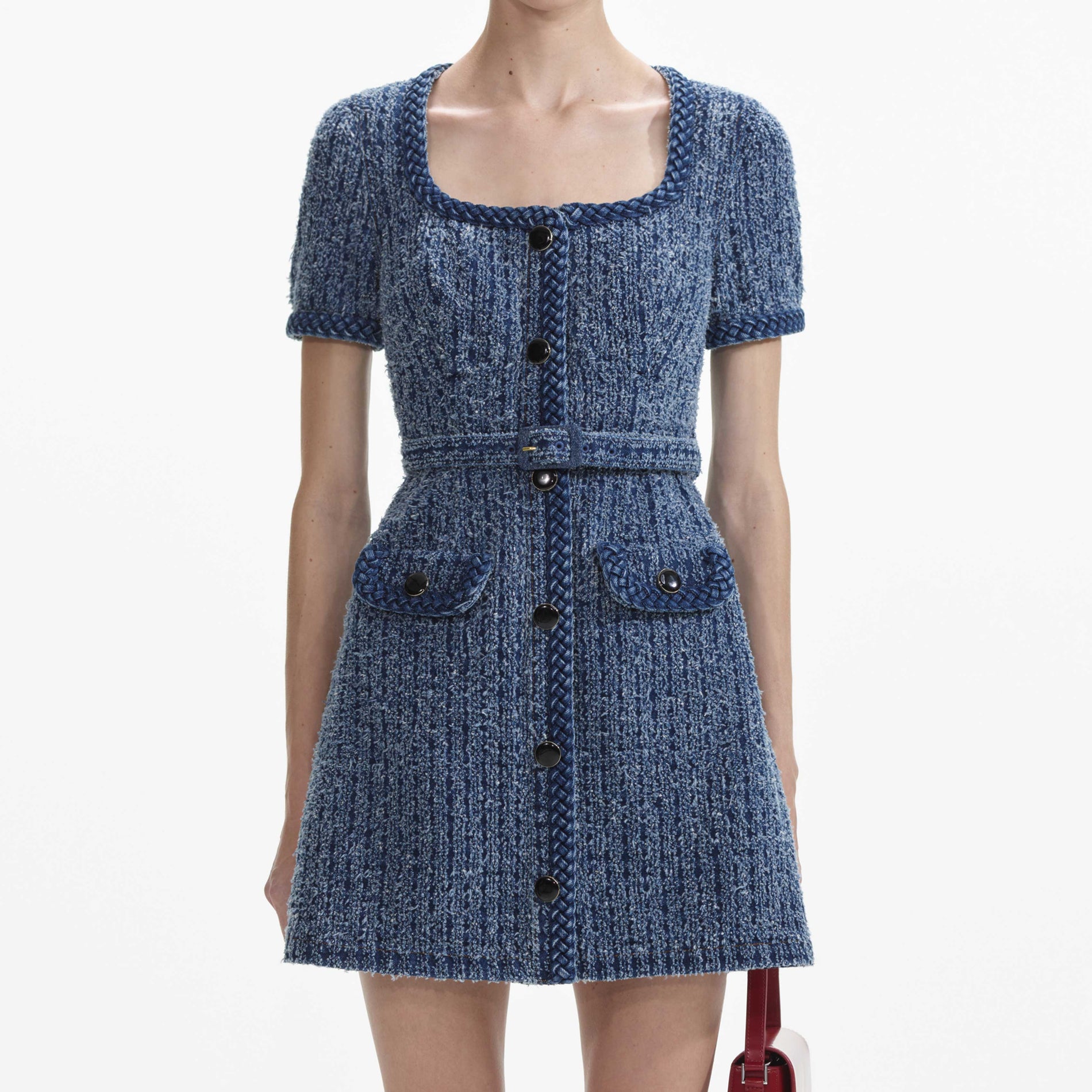 A close up of a woman wearing the Textured Denim Short Sleeve Mini Dress