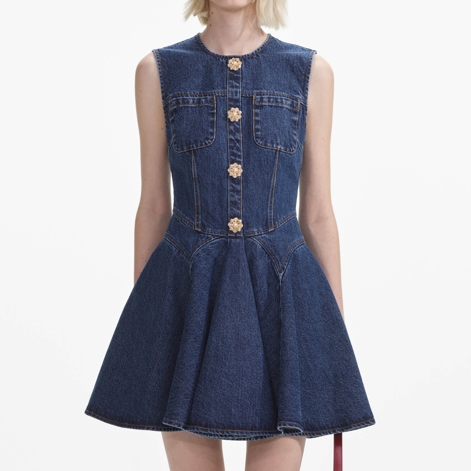 A close up of a woman wearing the Denim Skater Mini Dress