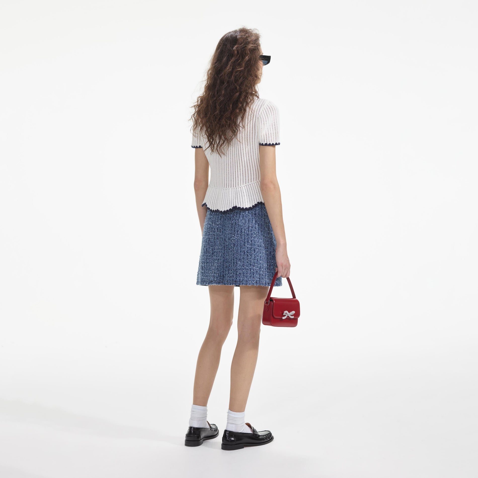 Back view of a woman wearing the Textured Denim Mini Skirt