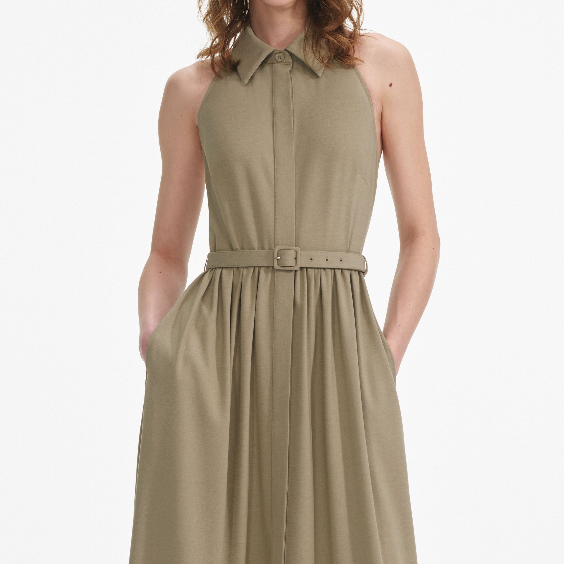 A close up of a woman wearing the Beige Sleeveless Twill Maxi Dress