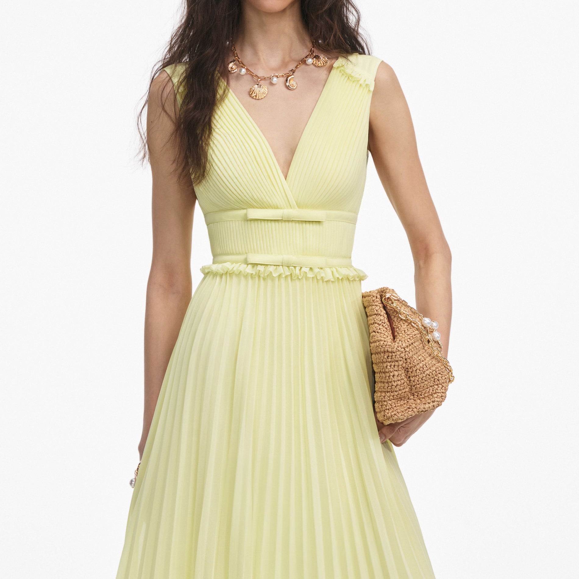 A close up of a woman wearing the Yellow Chiffon Midi Dress