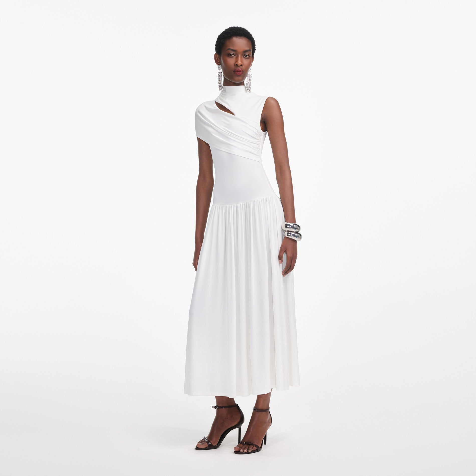 Side view of a woman wearing the White Jersey Cut Out Midi Dress