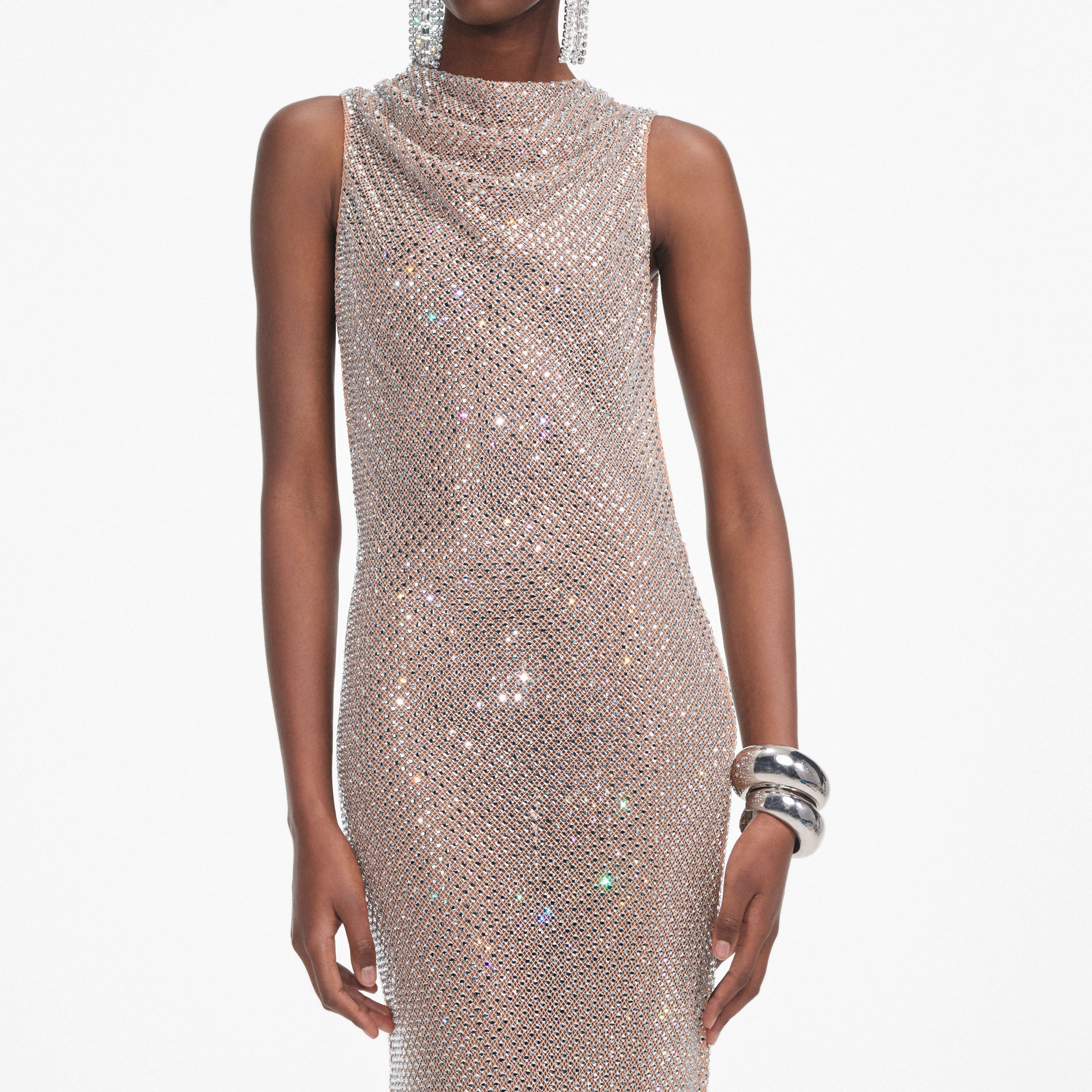 A close up of a woman wearing the Silver Rhinestone Drape Maxi Dress