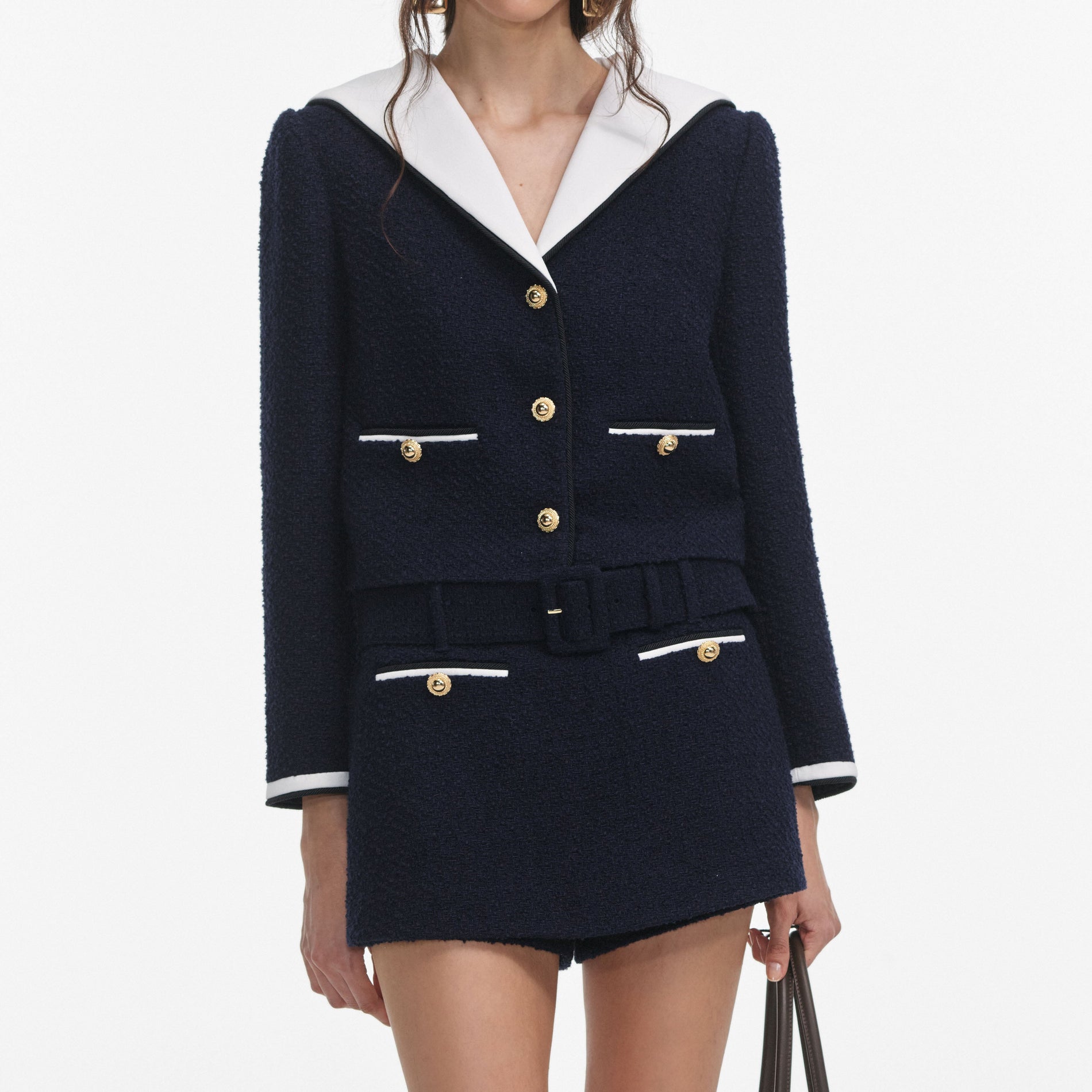 A close up of a woman wearing the Navy Boucle Contrast Collar Jacket