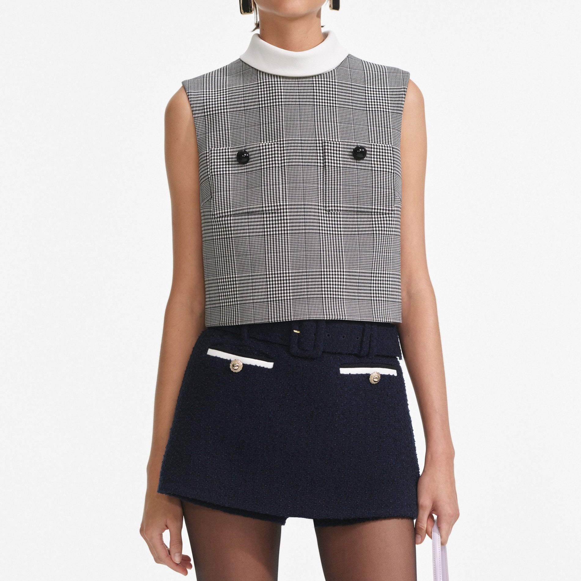 A close up of a woman wearing the Navy Boucle Skort