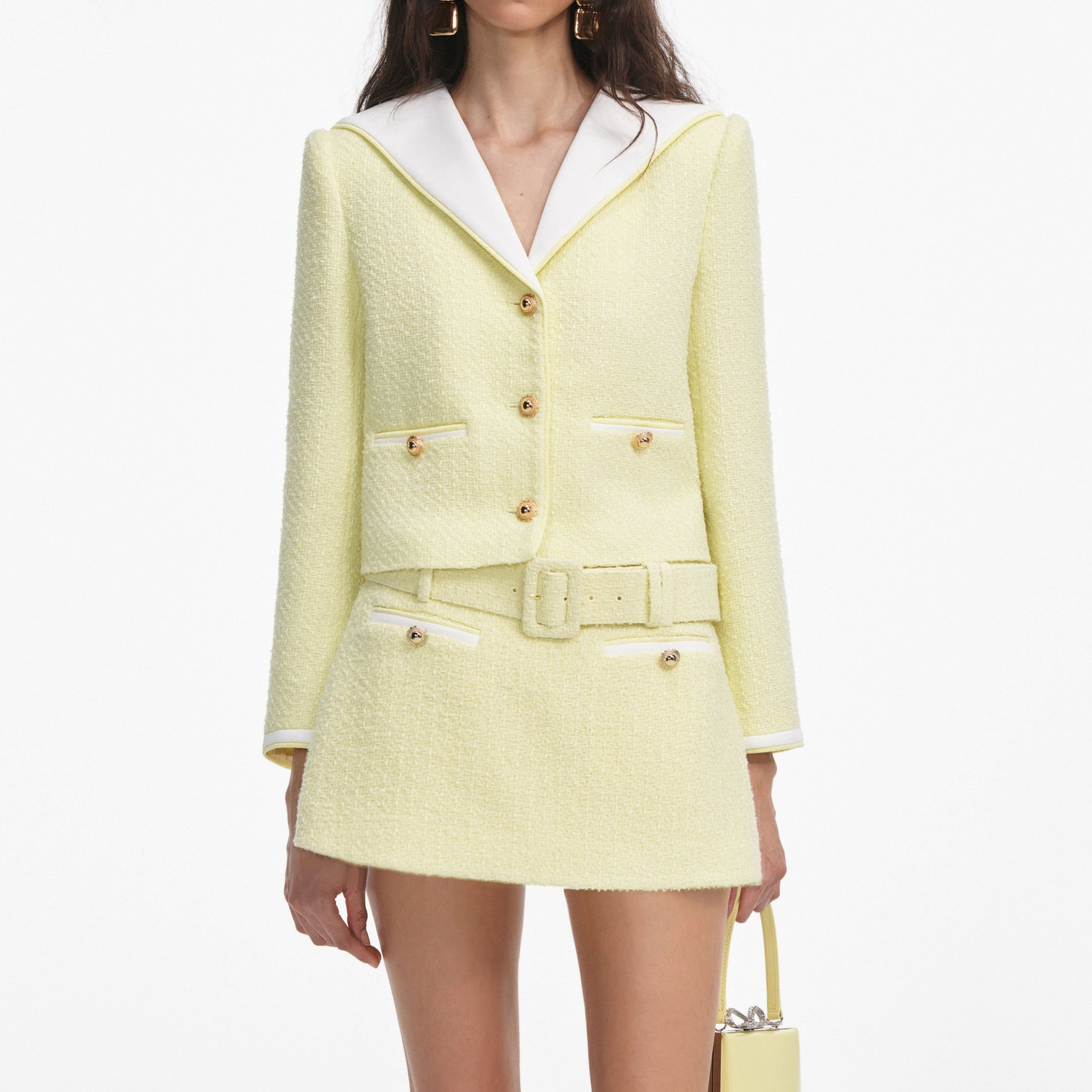 A close up of a woman wearing the Yellow Boucle Skort