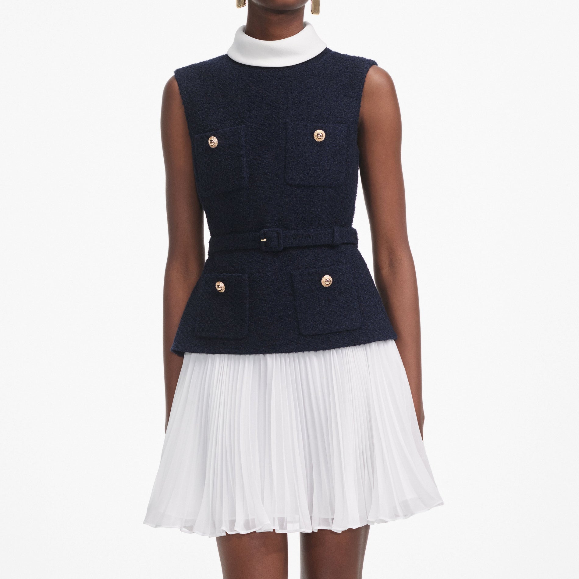 A close up of a woman wearing the Navy Boucle And Chiffon Mini Dress