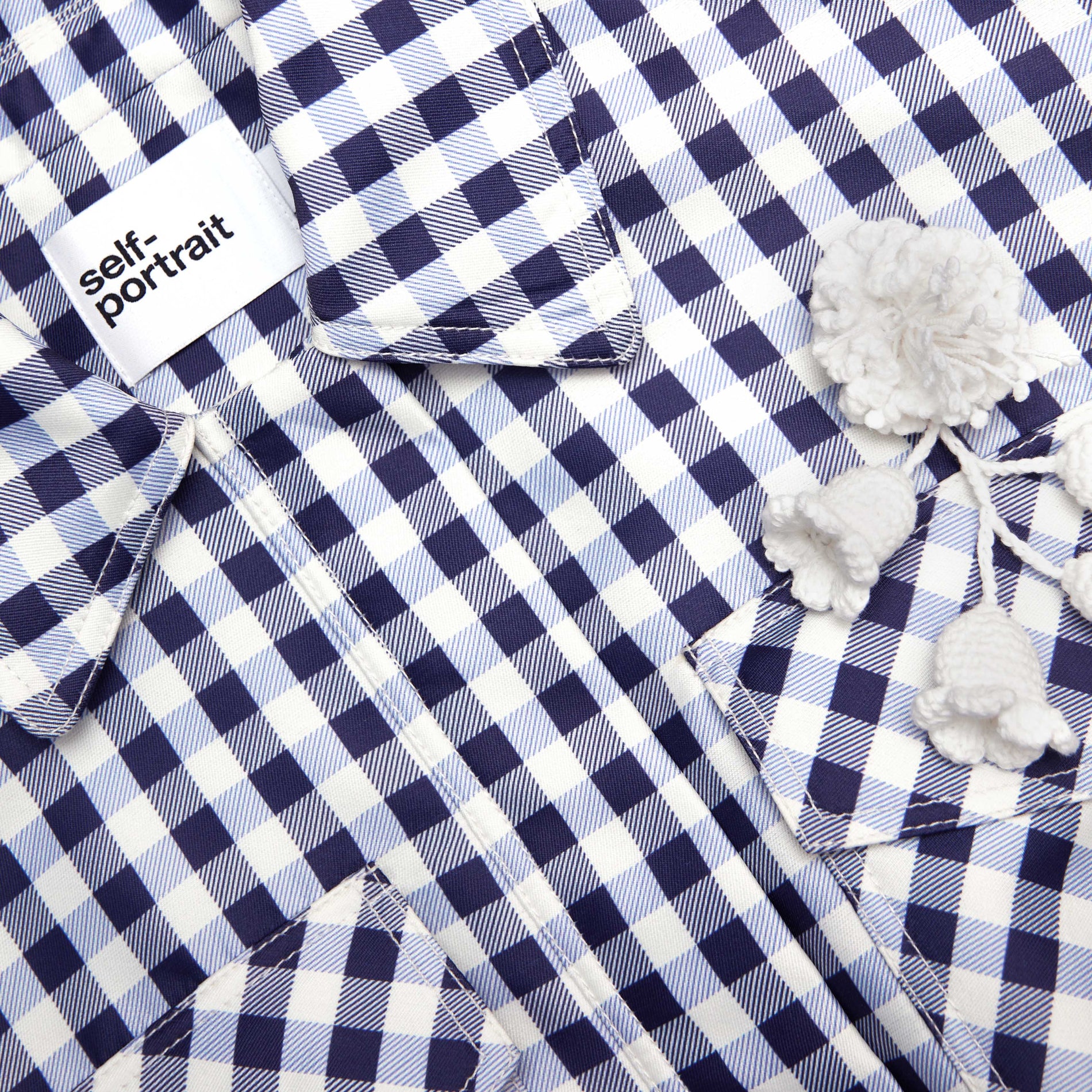 A close up of the fabric for the Navy Gingham Taffeta Jacket