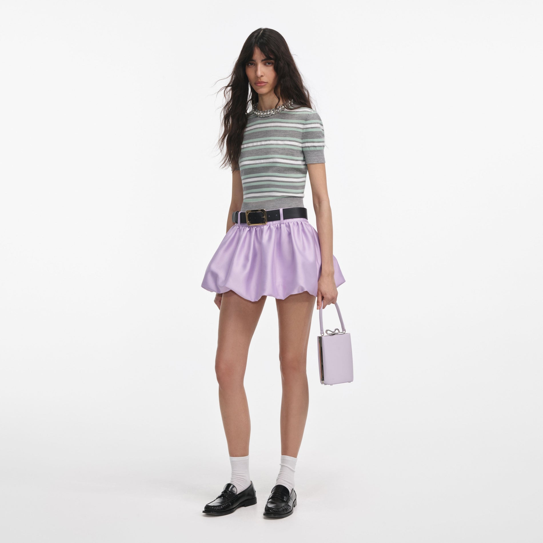 Side view of a woman wearing the Grey Striped Crystal Trim Knit Top