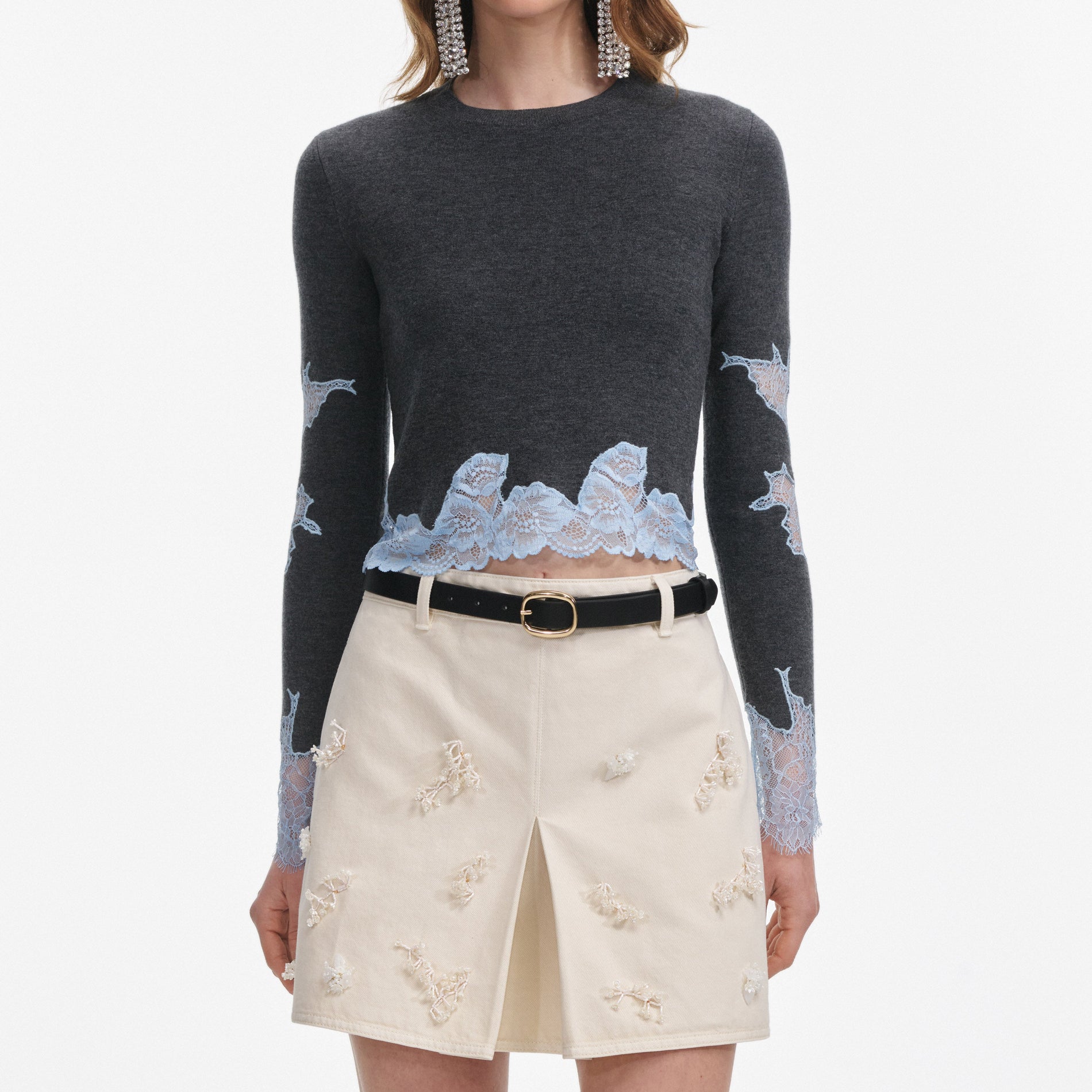 A close up of a woman wearing the Grey Contrast Lace Jumper