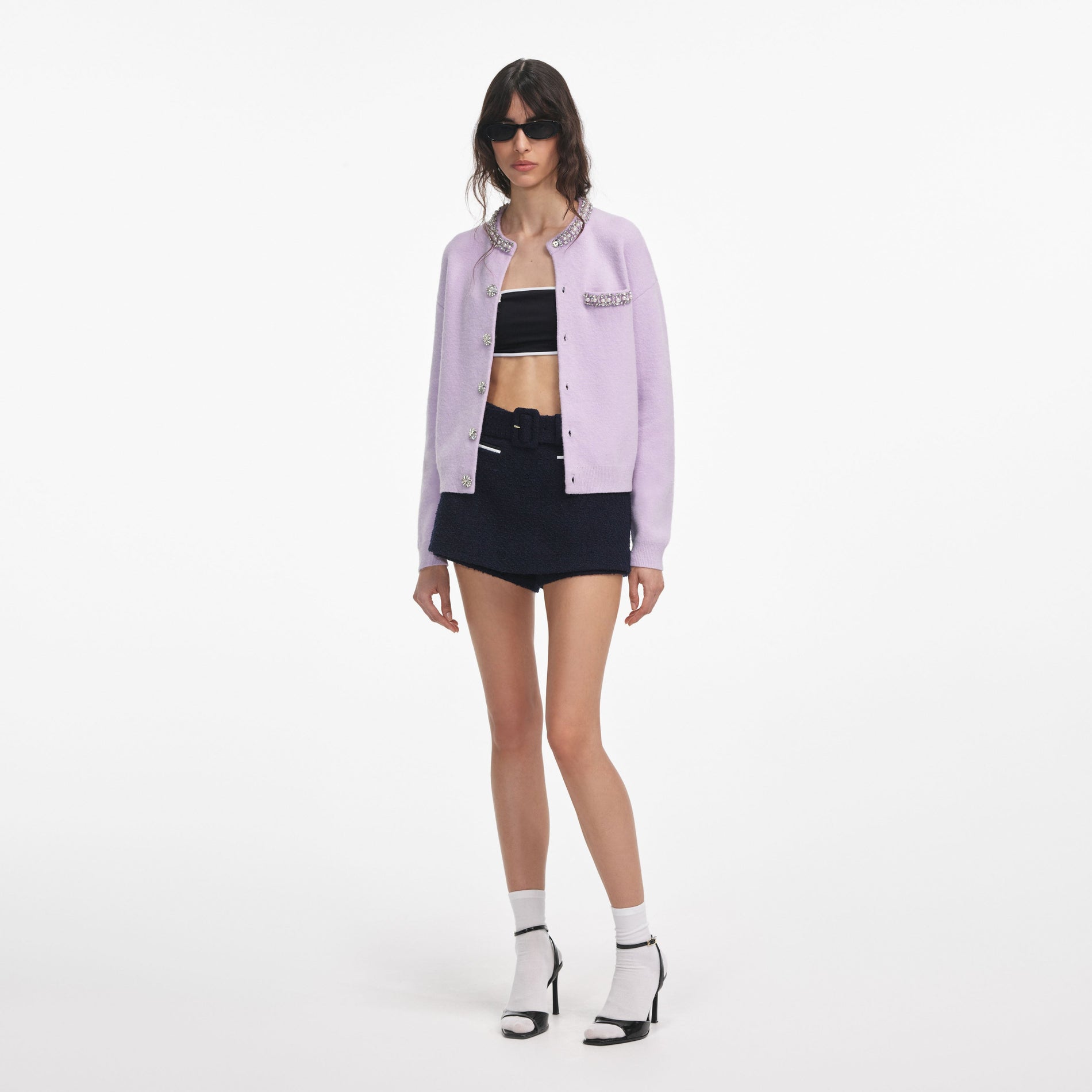 Side view of a woman wearing the Lilac Crystal Trim Cardigan