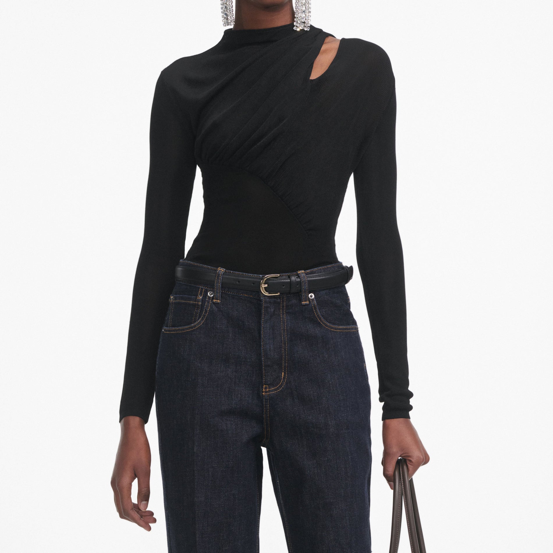 A close up of a woman wearing the Black Cut Out Viscose Knit Top
