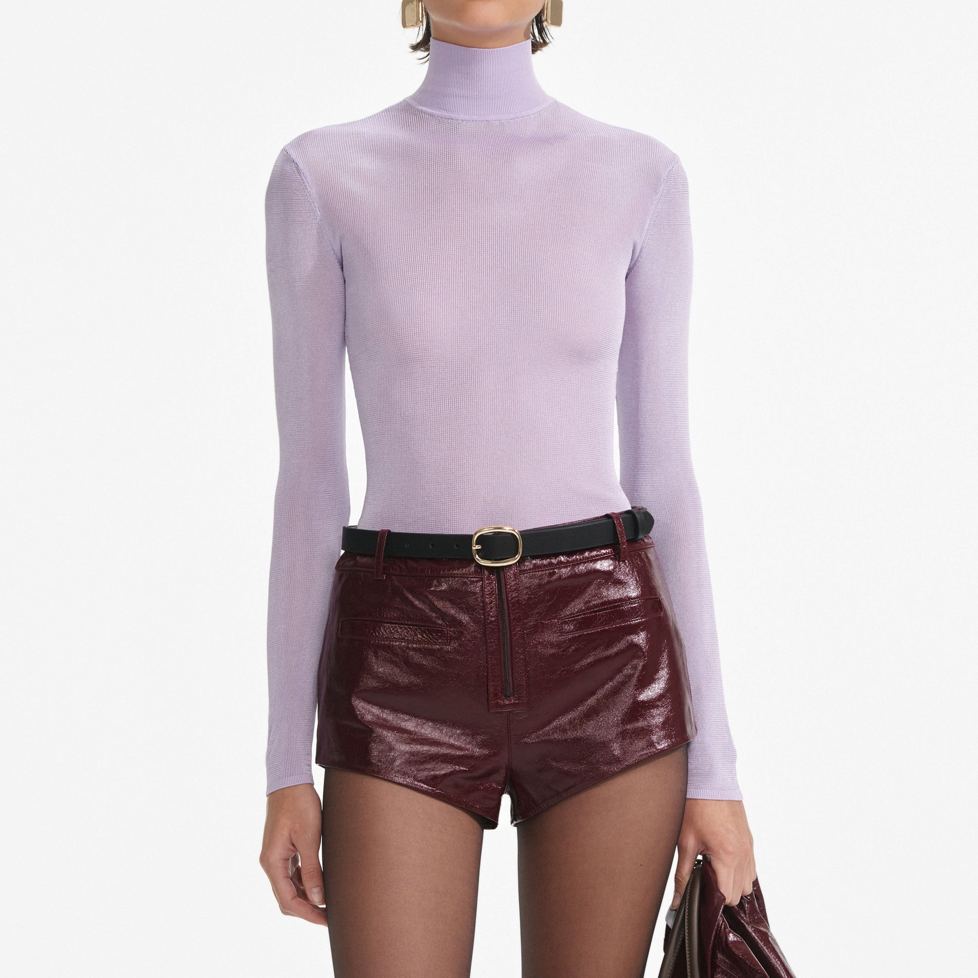 A close up of a woman wearing the Lilac Viscose Knit Top