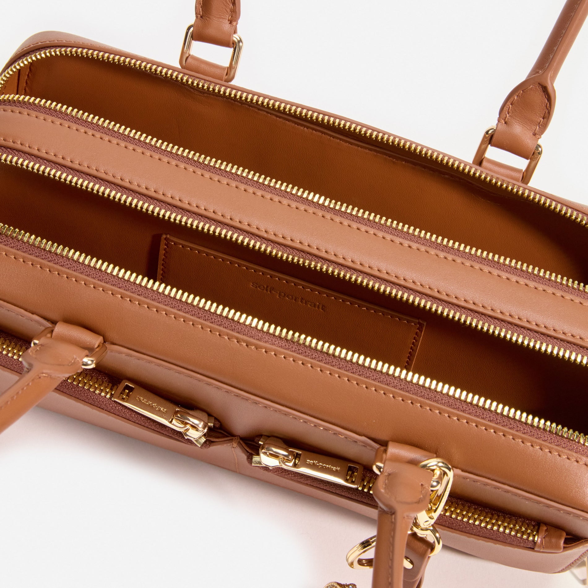 Tan Leather Baguette Shoulder Bag With Charm