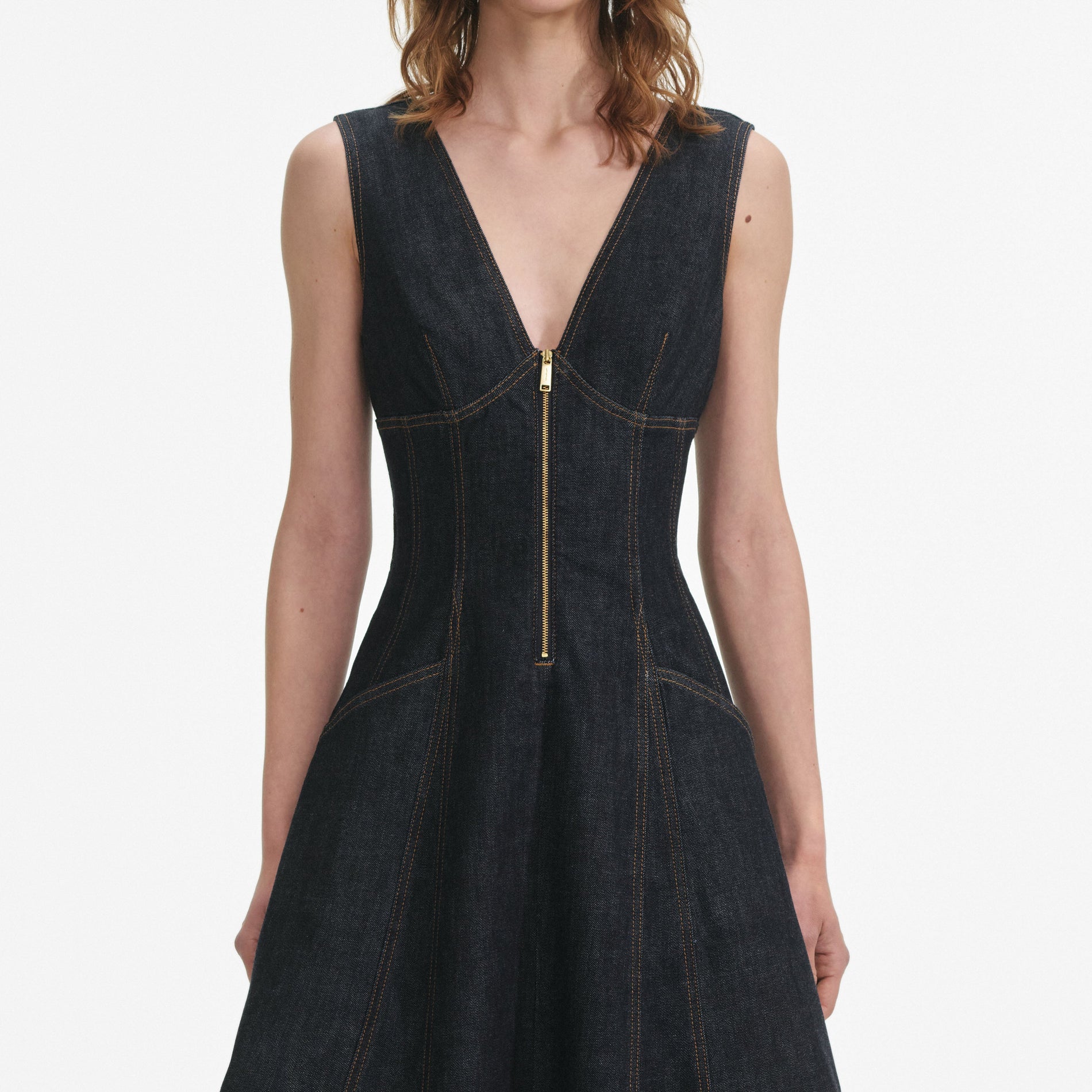 A close up of a woman wearing the Indigo Denim Midi Dress