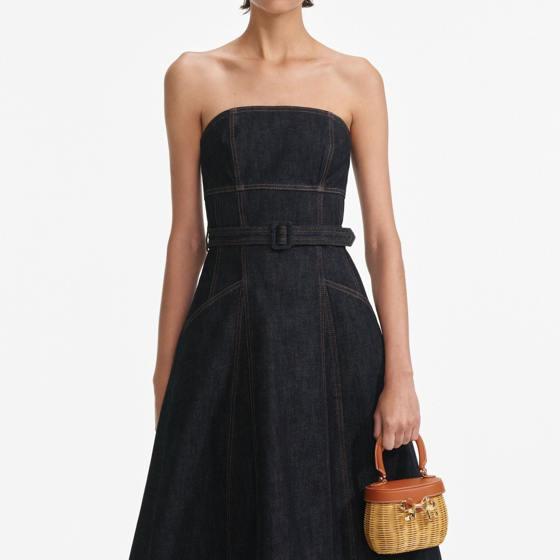 A close up of a woman wearing the Indigo Denim Bandeau Midi Dress