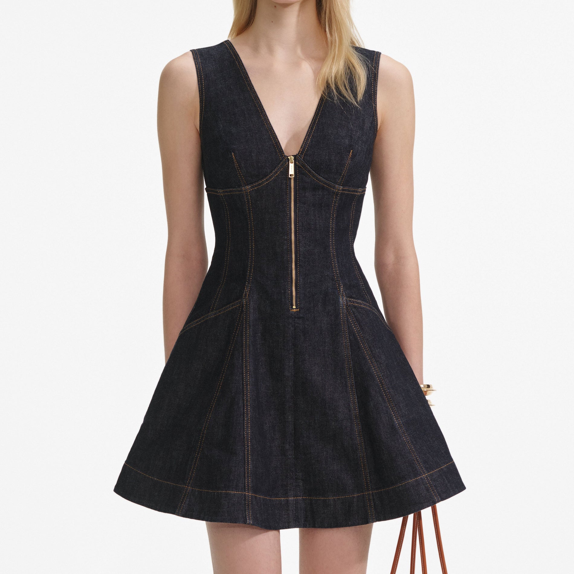 A close up of a woman wearing the Indigo Denim Mini Dress
