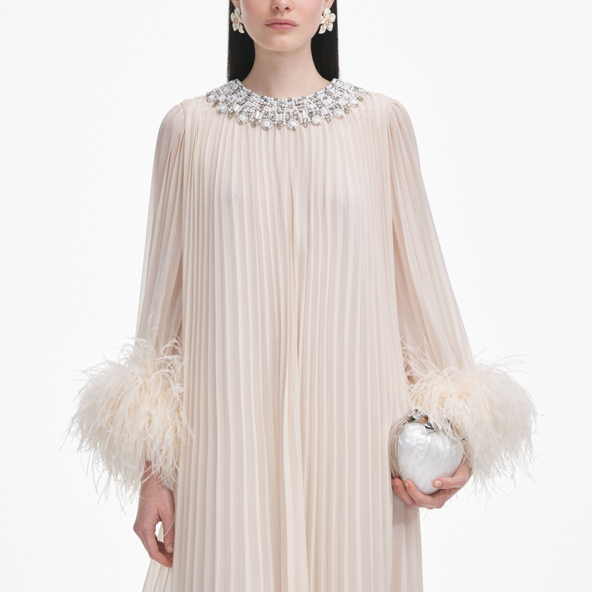 A close up of a woman wearing the Cream Chiffon Feather Midi Dress