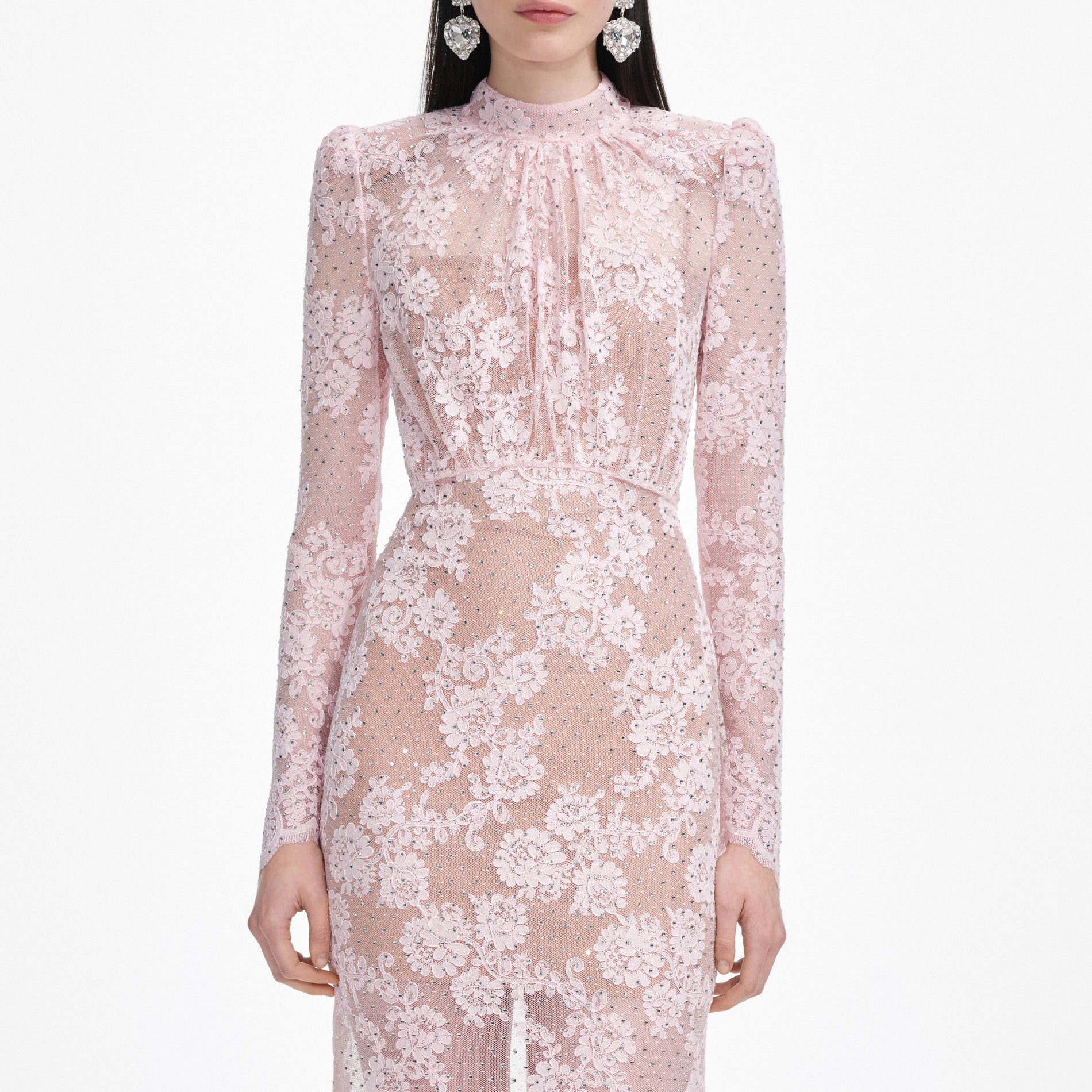A close up of a woman wearing the Pale Pink Rhinestone Lace Maxi Dress