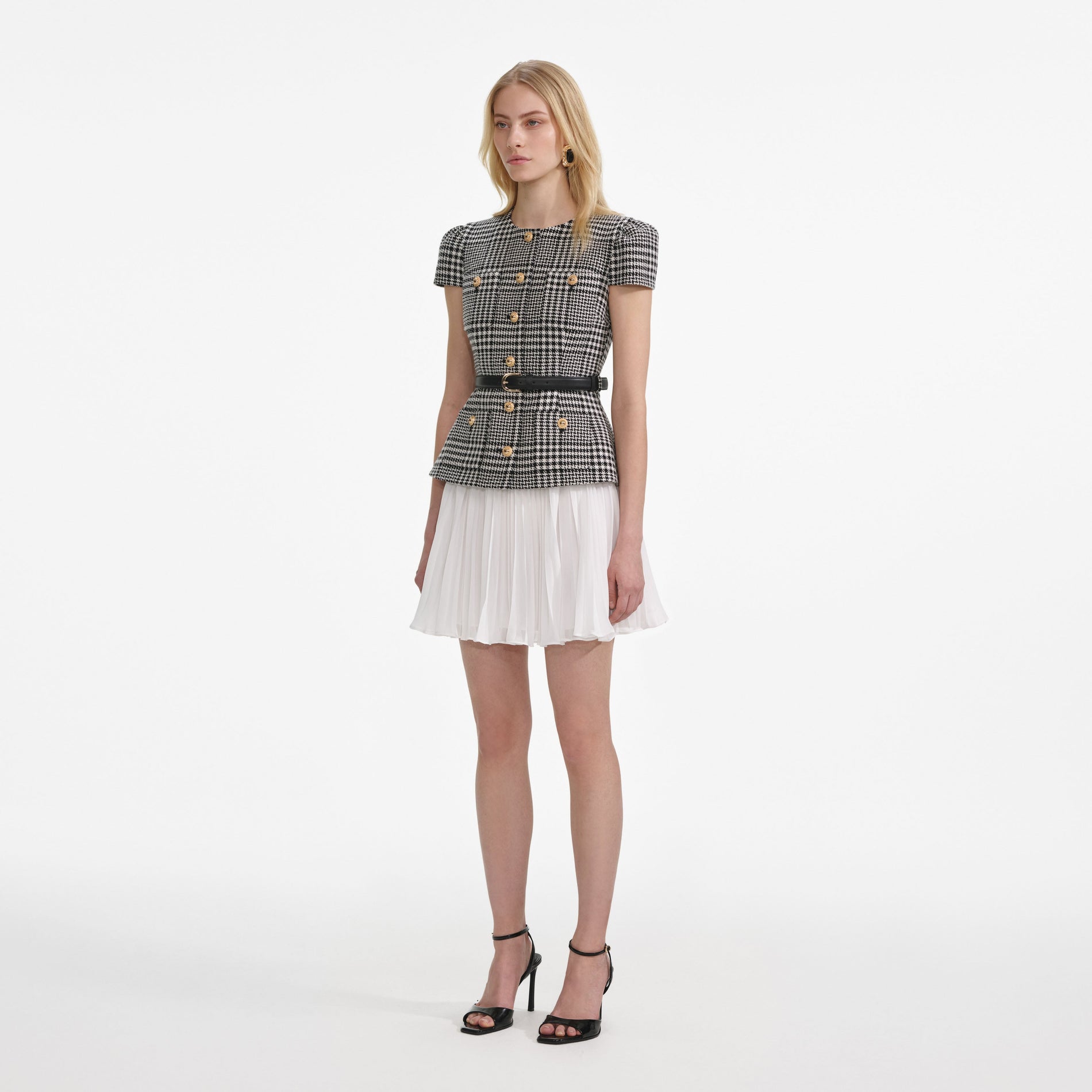 Side view of a woman wearing the Houndstooth Mini Dress