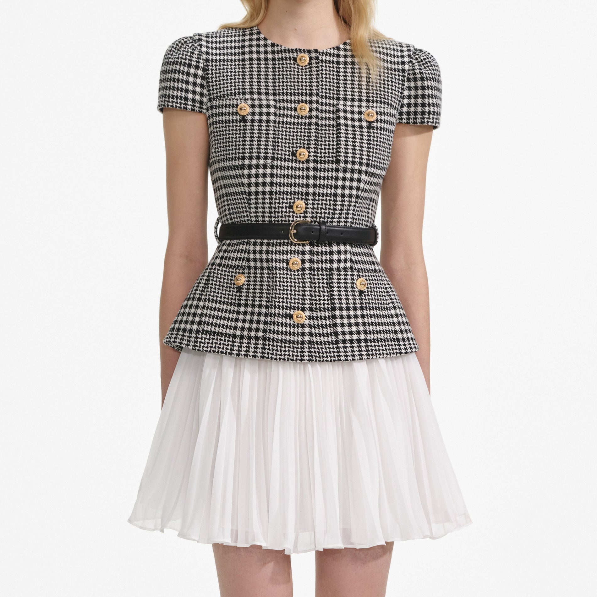 A close up of a woman wearing the Houndstooth Mini Dress