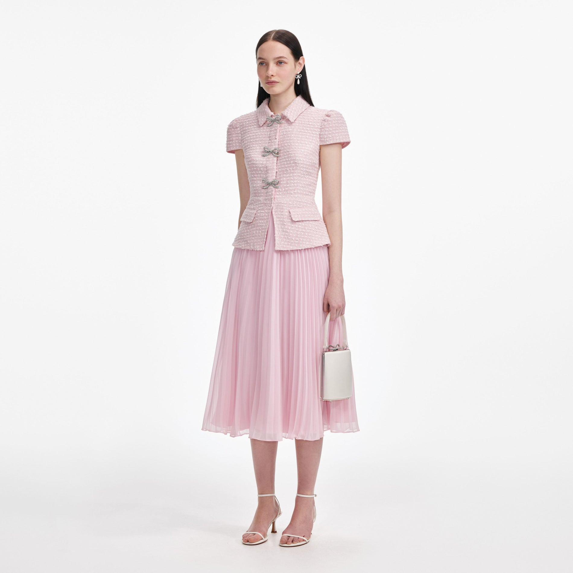 Side view of a woman wearing the Pink Boucle Midi Dress